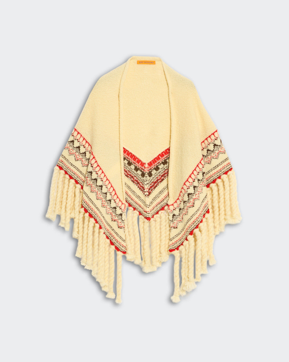 Cream-colored Cloud Chalet shawl with fairisle pattern and thick twisted rope fringe detailing