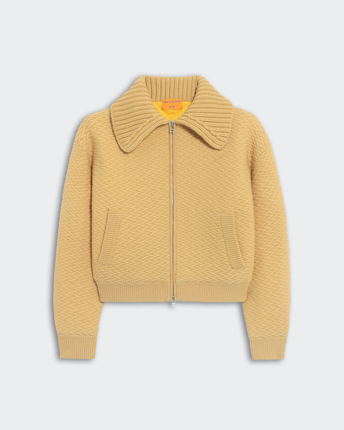 Beige heavyweight textured bomber jacket with chunky rib polo collar and front side pockets, insulated quilted lining.