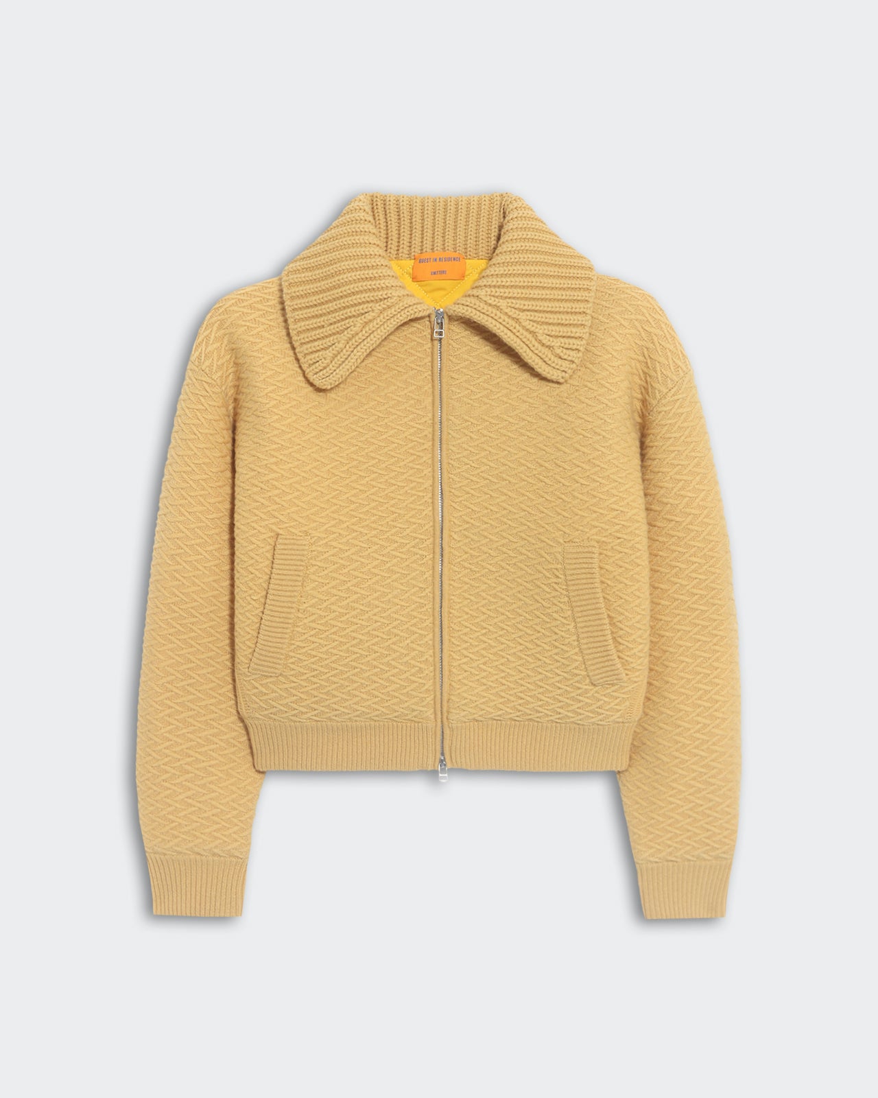 Beige heavyweight textured bomber jacket with chunky rib polo collar and front side pockets, insulated quilted lining.