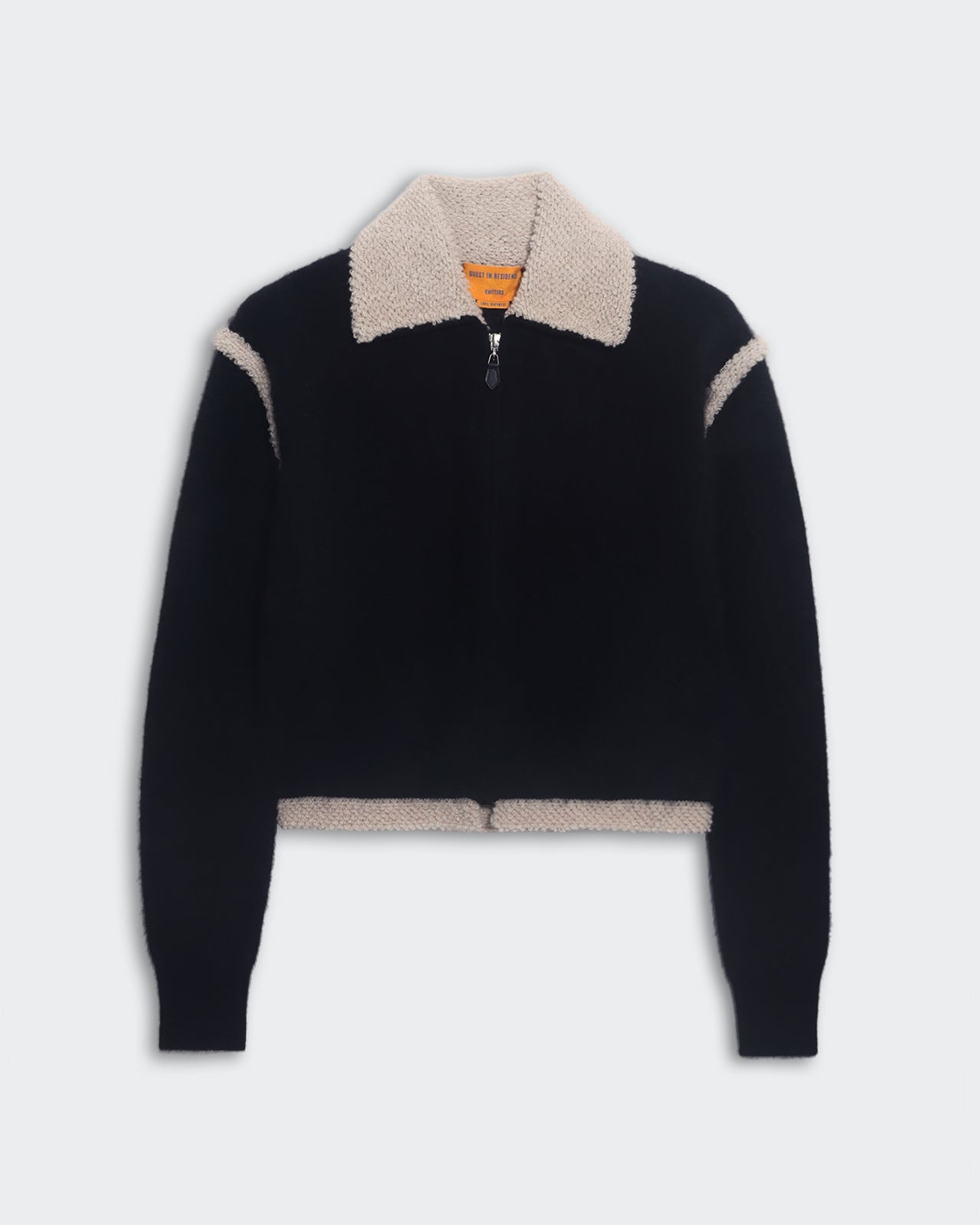 Black and oatmeal cropped Grizzly Frankie jacket with faux shearling and two-way zipper closure.