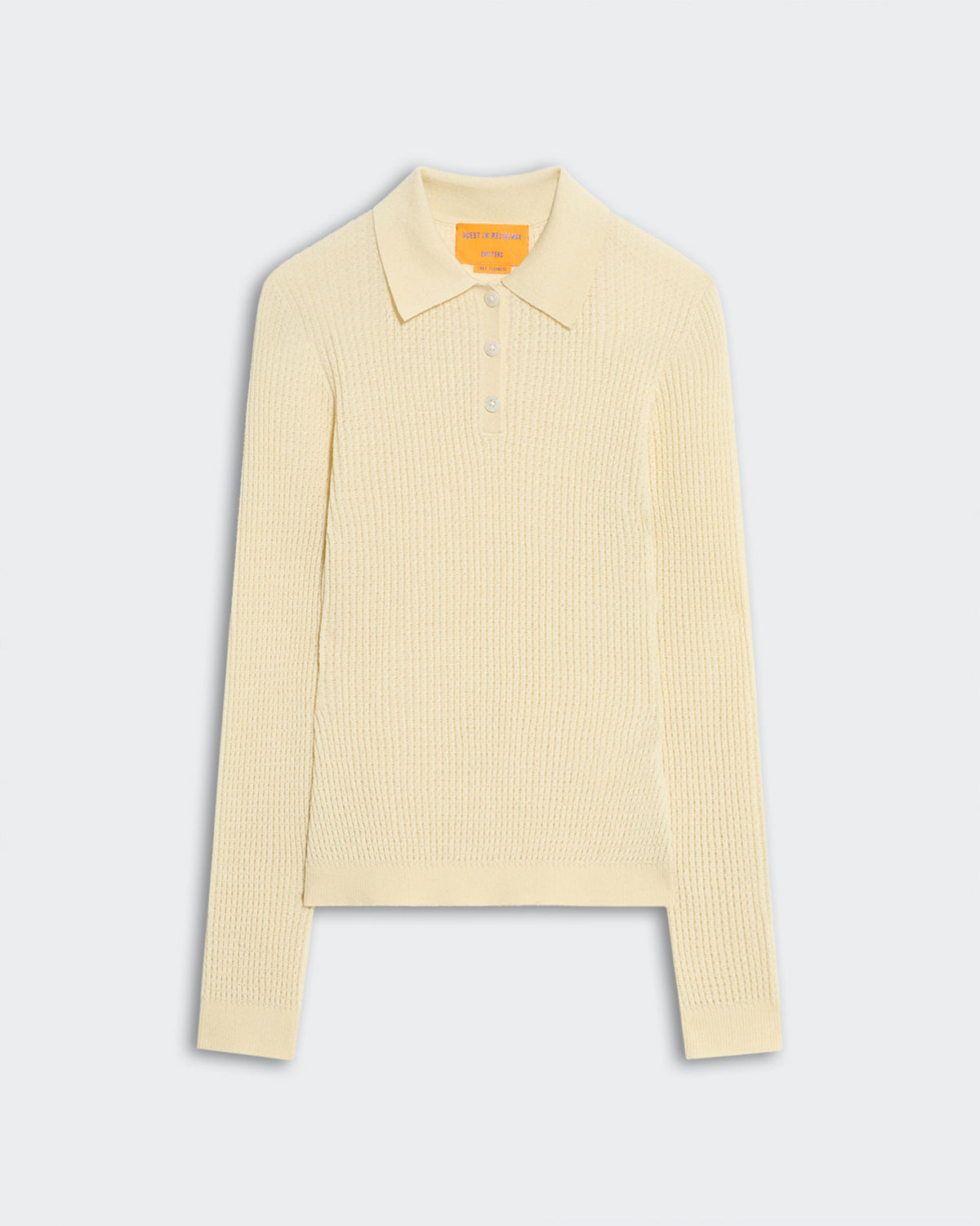 Lightweight women's long sleeve shrunken polo in mist color with waffle knit texture and ribbed collar and cuffs.