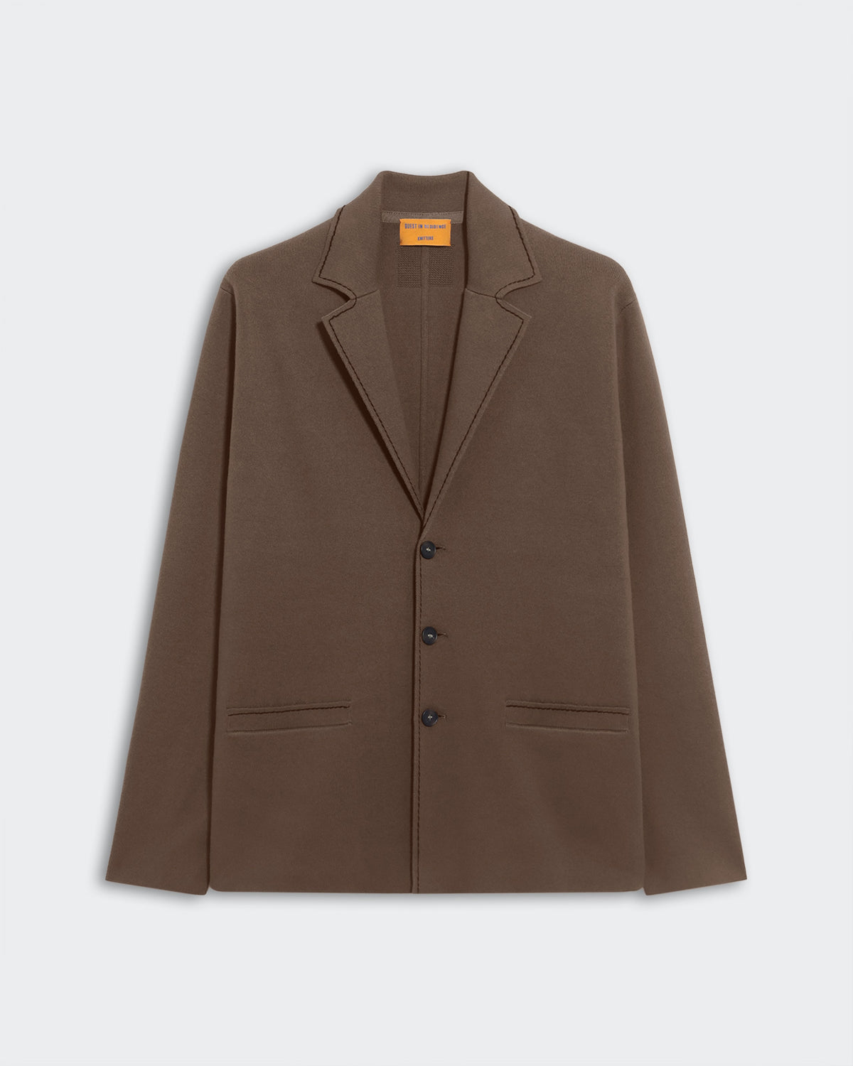 Off Duty Blazer - Cypress, a relaxed-fit deep olive green blazer with notch lapels, three-button closure, and two horizontal front pockets, displayed flat on a light background.