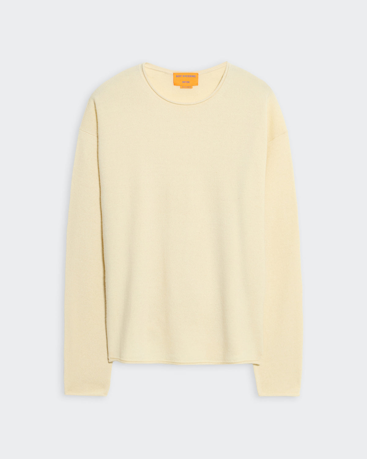 Lightweight oversized cream crew neck sweater with dropped shoulders and curved shirttail hem for men and women