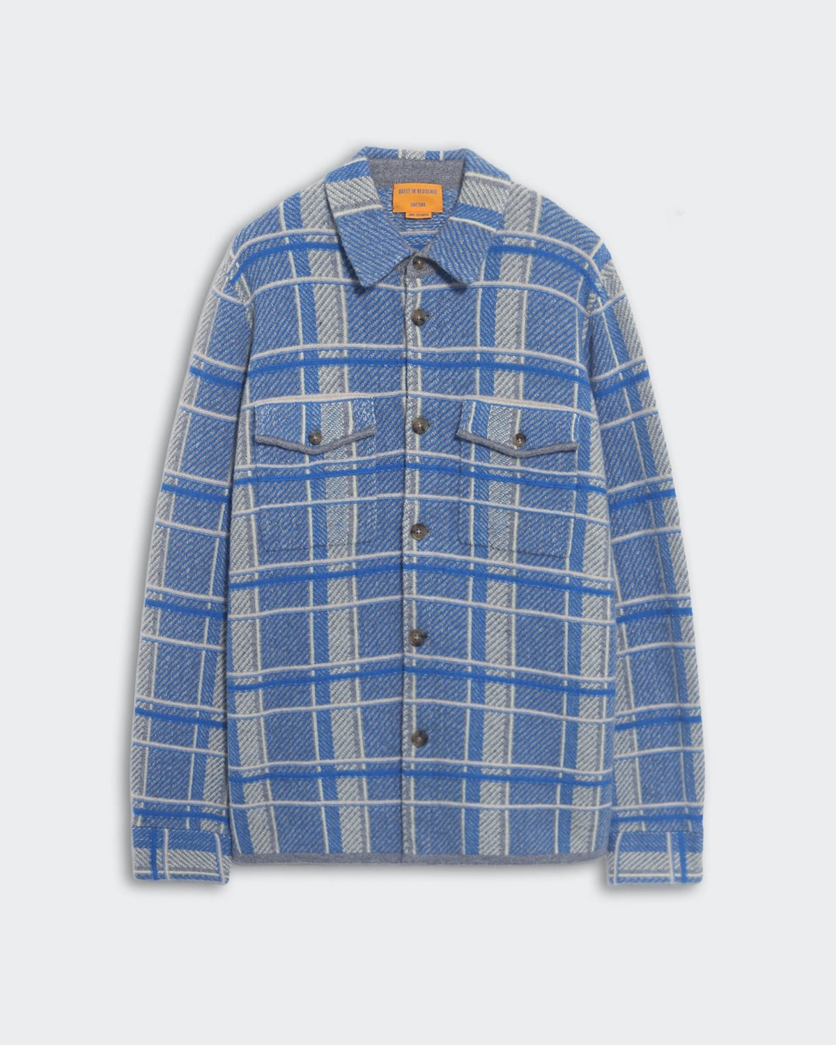 Blue and gray plaid work shirt with front button closure and chest patch pockets laid flat on white background