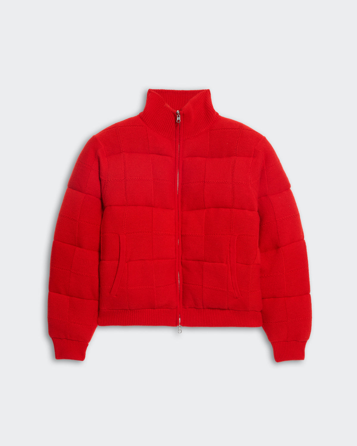 Red insulated quilted puffer jacket with square grid stitching, front pockets, ribbed turtleneck, and zip closure.