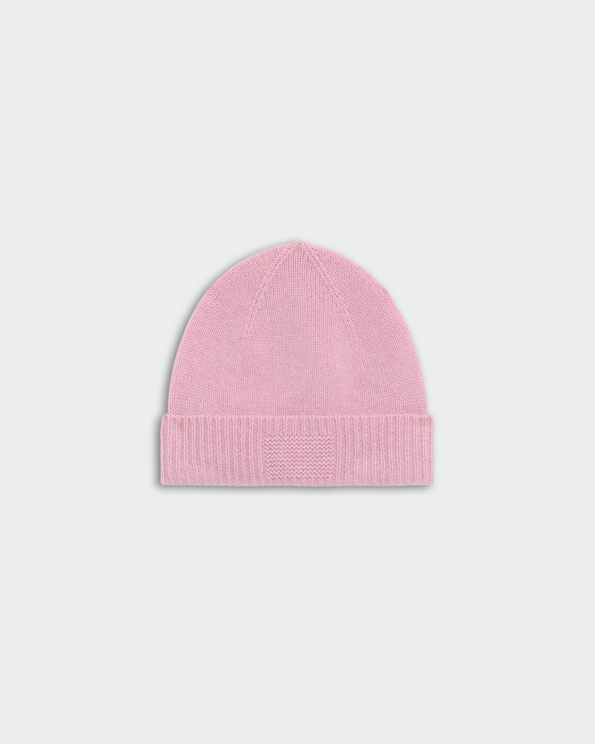 Light pink rib cuff beanie made of 100% premium cashmere with GIR branding on cuff, unisex and medium-weight design