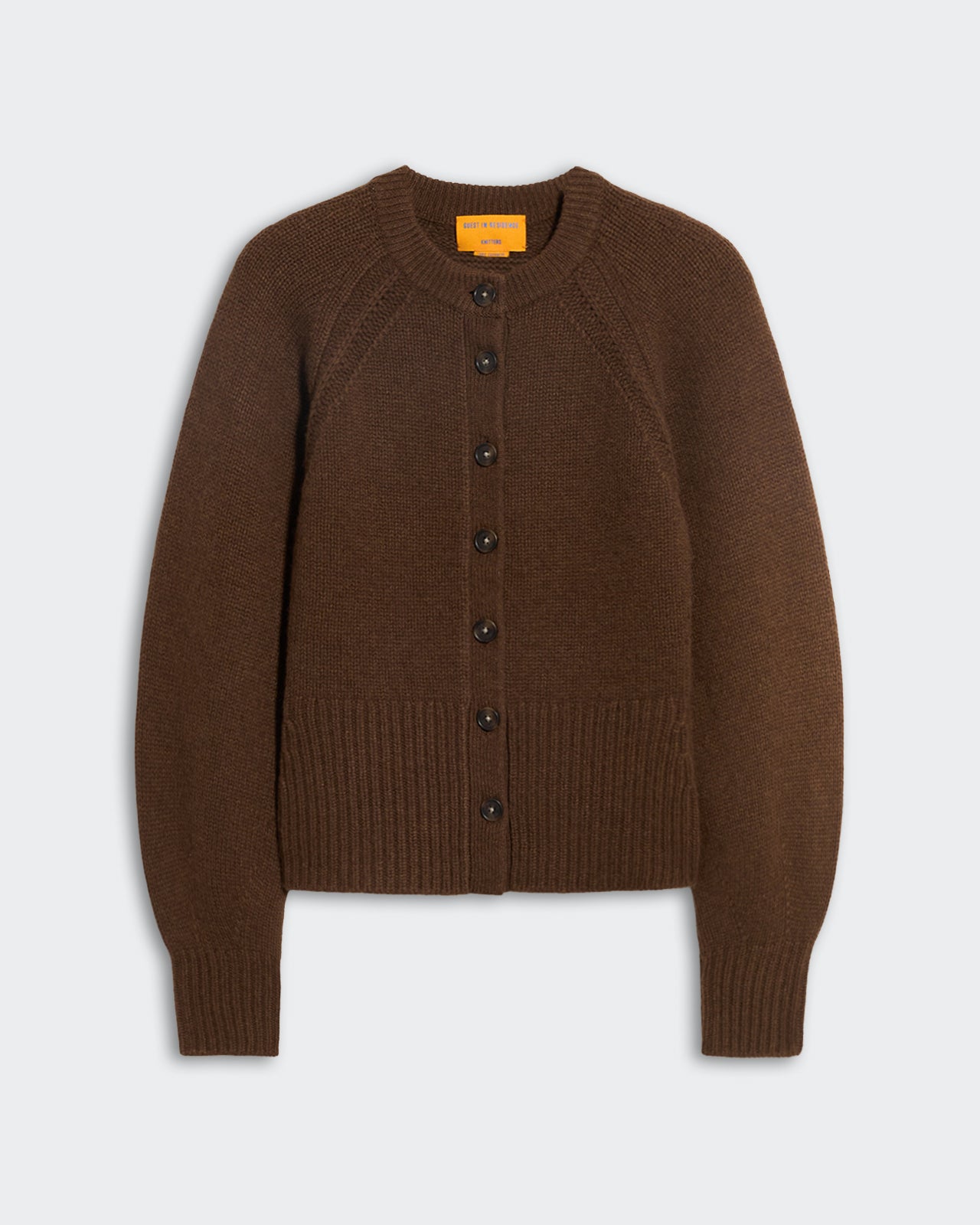Chestnut brown women's cashmere cardigan with front buttons, raglan sleeves, ribbed hem, and sculpted puffed sleeves design.