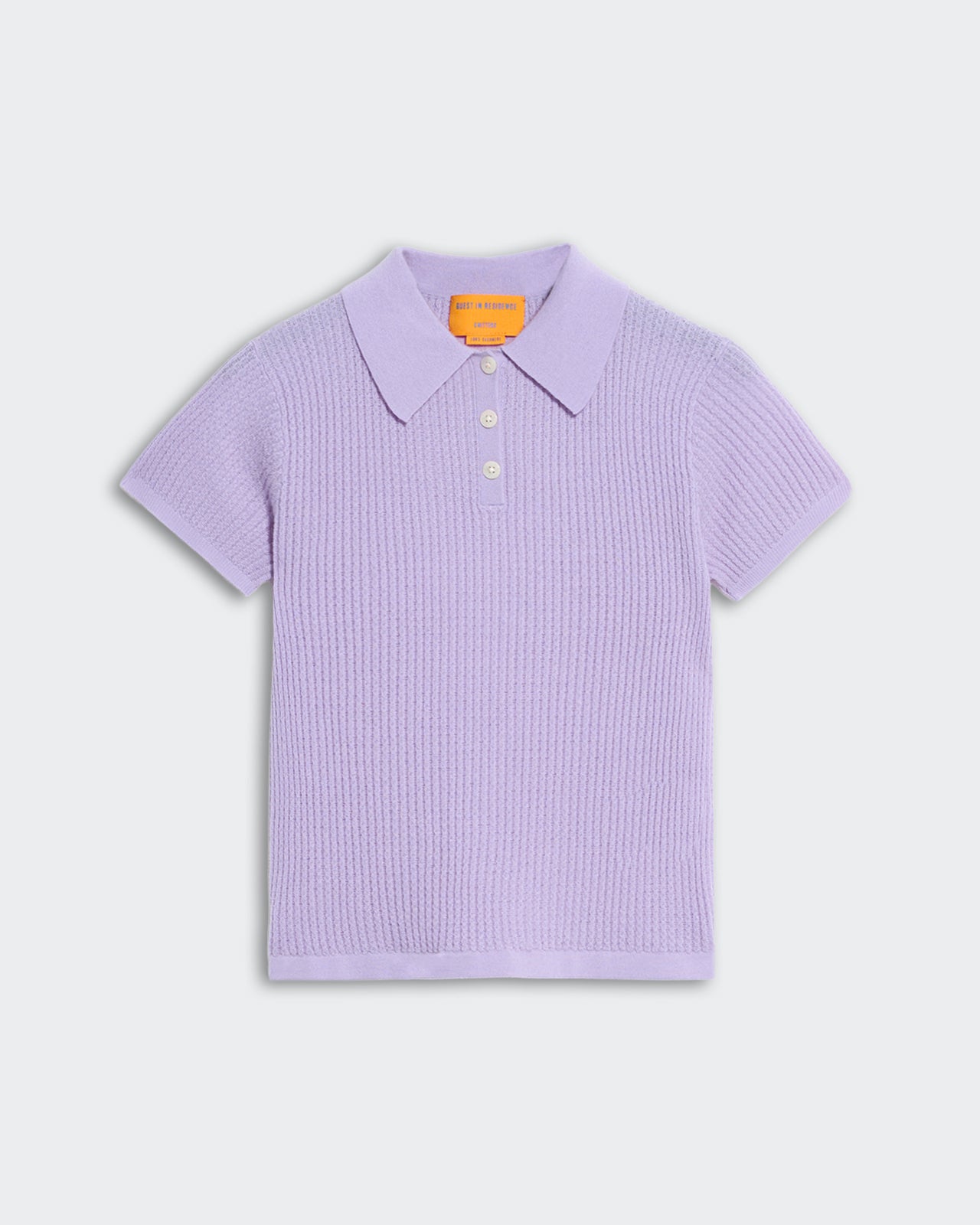 Light purple women’s shrunken polo shirt with waffle knit texture and three-button placket on white background