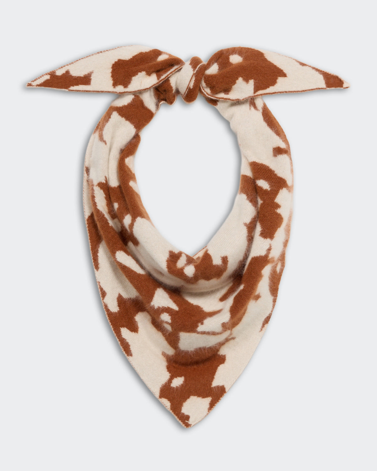 Grizzly Cowhide Wild Rag - Cream/Burnt Sienna cashmere scarf with a cowhide pattern, designed for stylish and cozy wear, tied in a knot at the top.