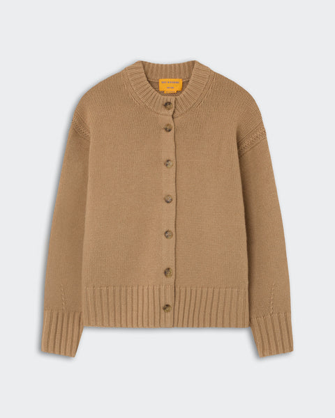 Tan knitted cardigan with a ribbed collar, cuffs, and hem, featuring a front button closure with six buttons on a light gray background.