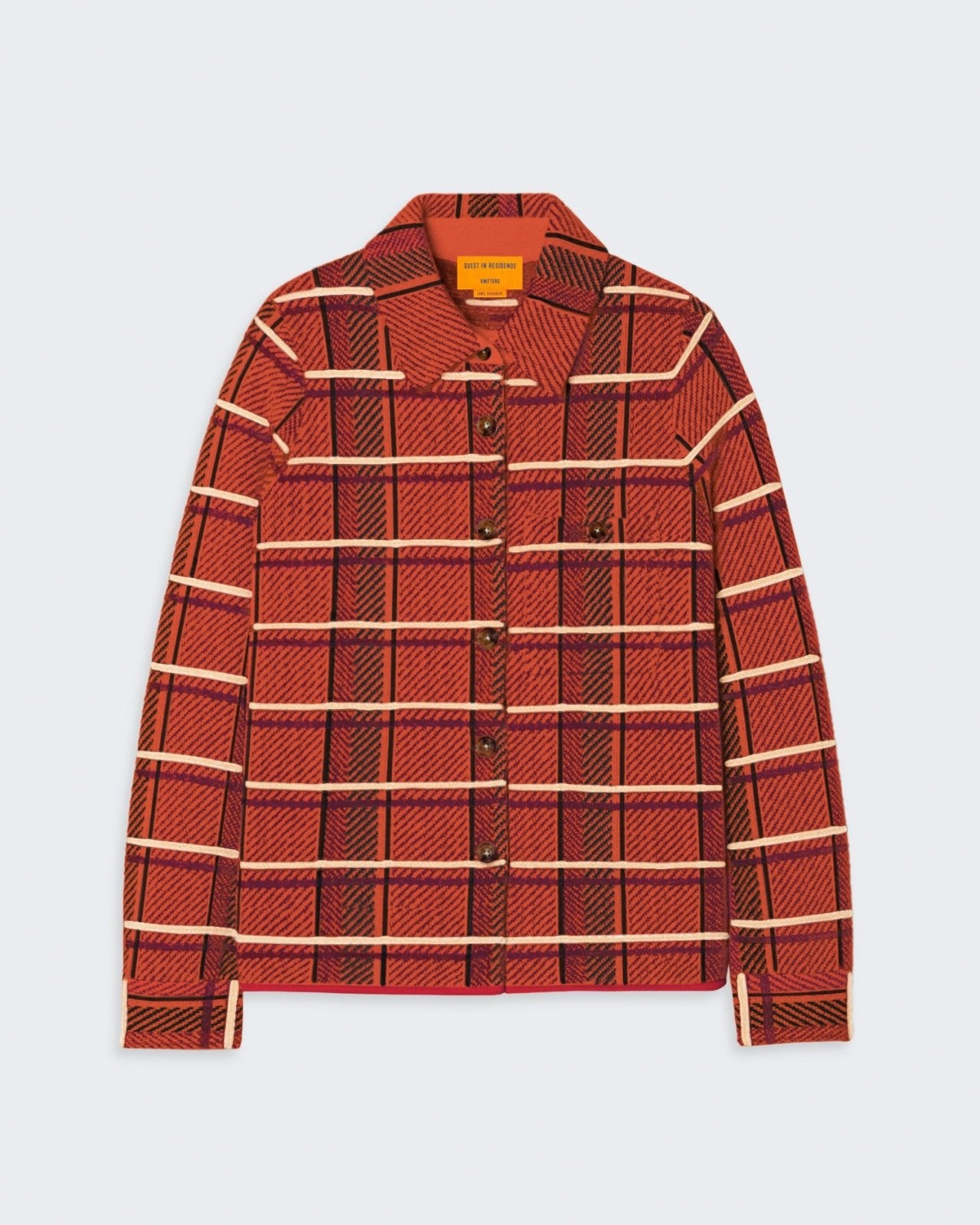 A red and orange plaid cashmere button-down shirt with chest pockets and a curved hem.