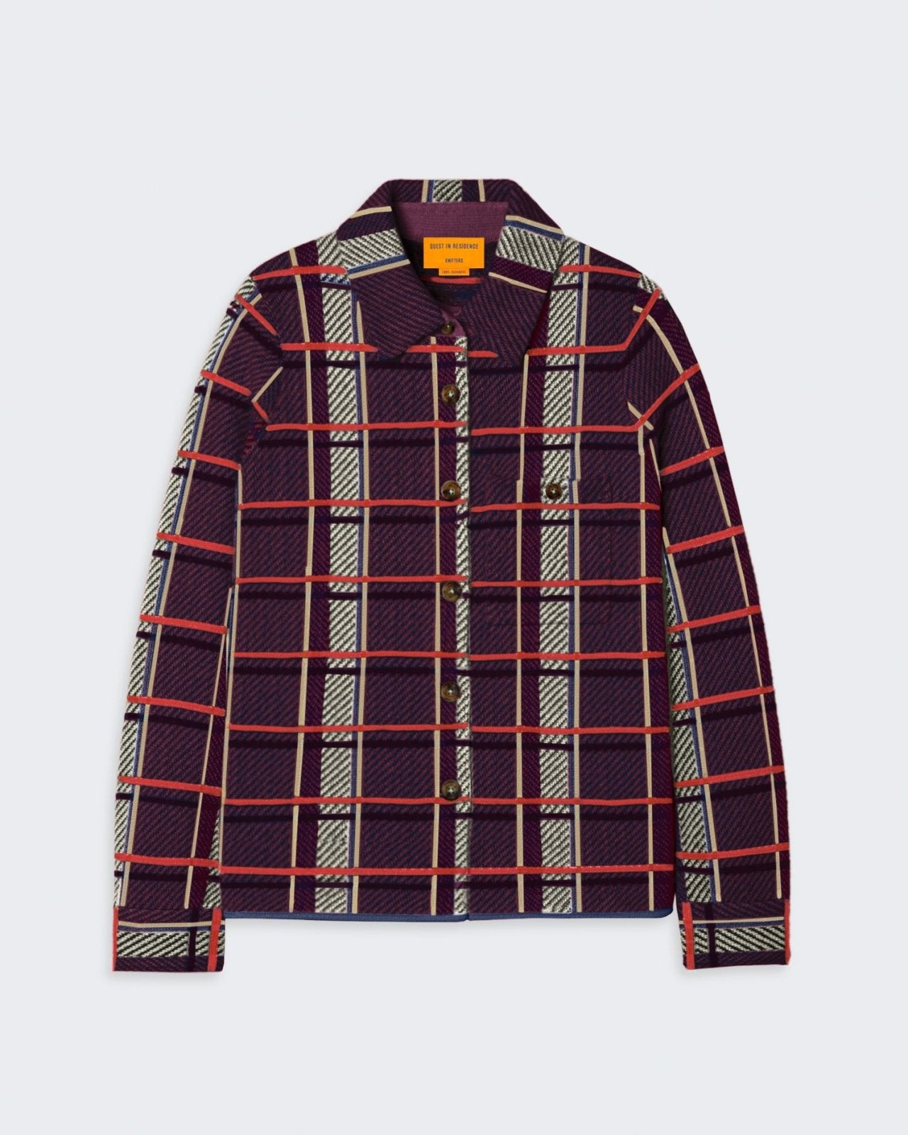 A plaid button-down shirt in a relaxed fit, featuring a shirt collar, chest patch pockets, curved hem, and cuffed sleeves.