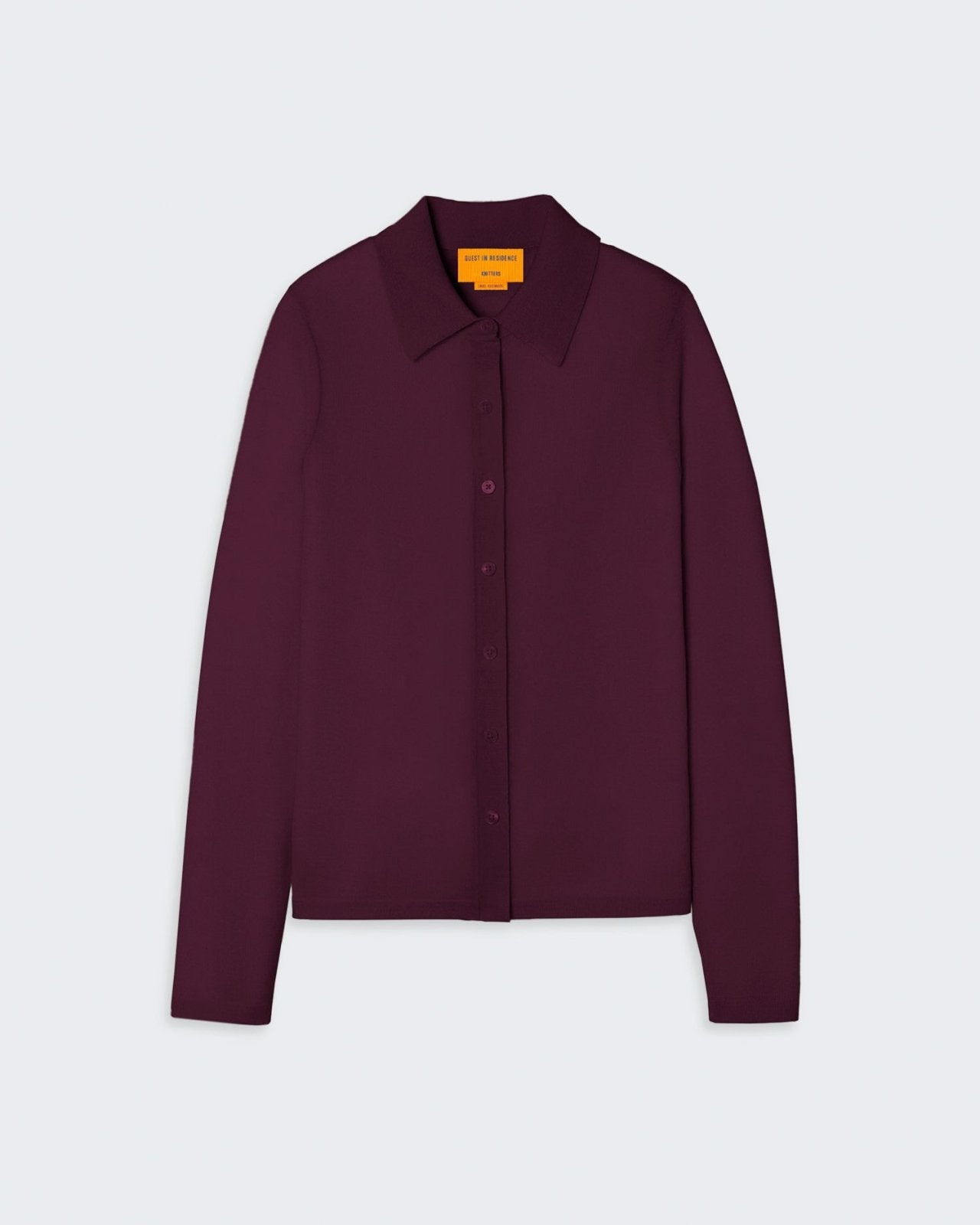 Women's burgundy cashmere button-down shirt with a collar and front pocket.