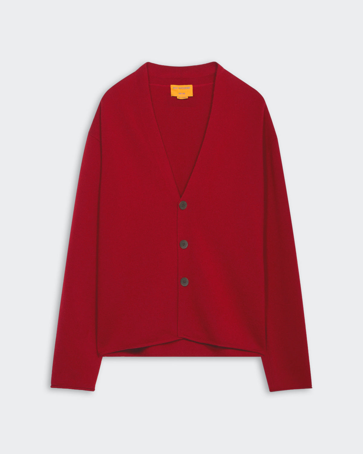 Ruby red medium-weight men's cardigan with three buttons, shawl collar, roll hem, and signature GIR branding