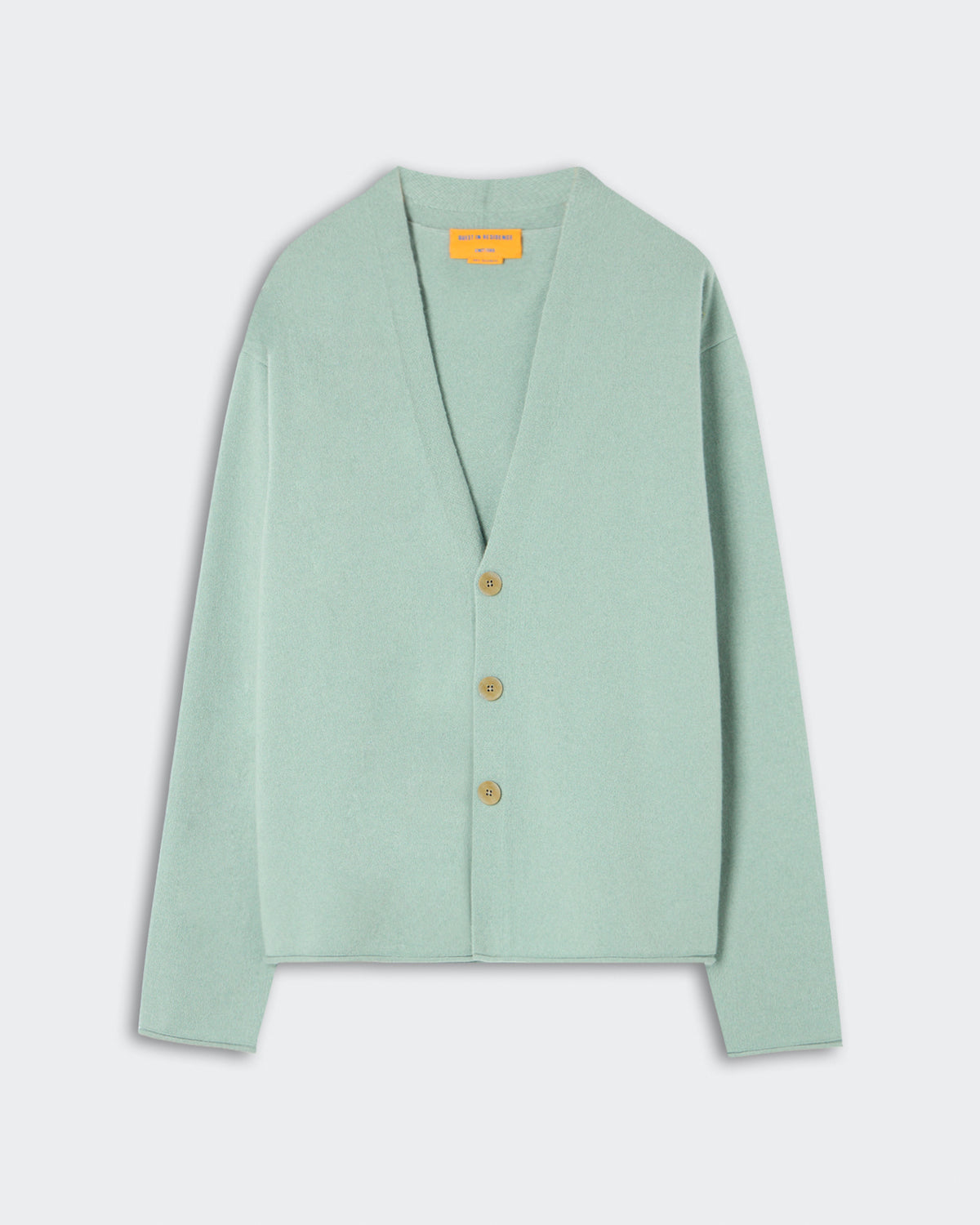 Everywear Cardigan - Sage Brush in a muted green shade, crafted from soft cashmere with a relaxed fit, deep V-neck, and three natural buttons for a minimalist closure.