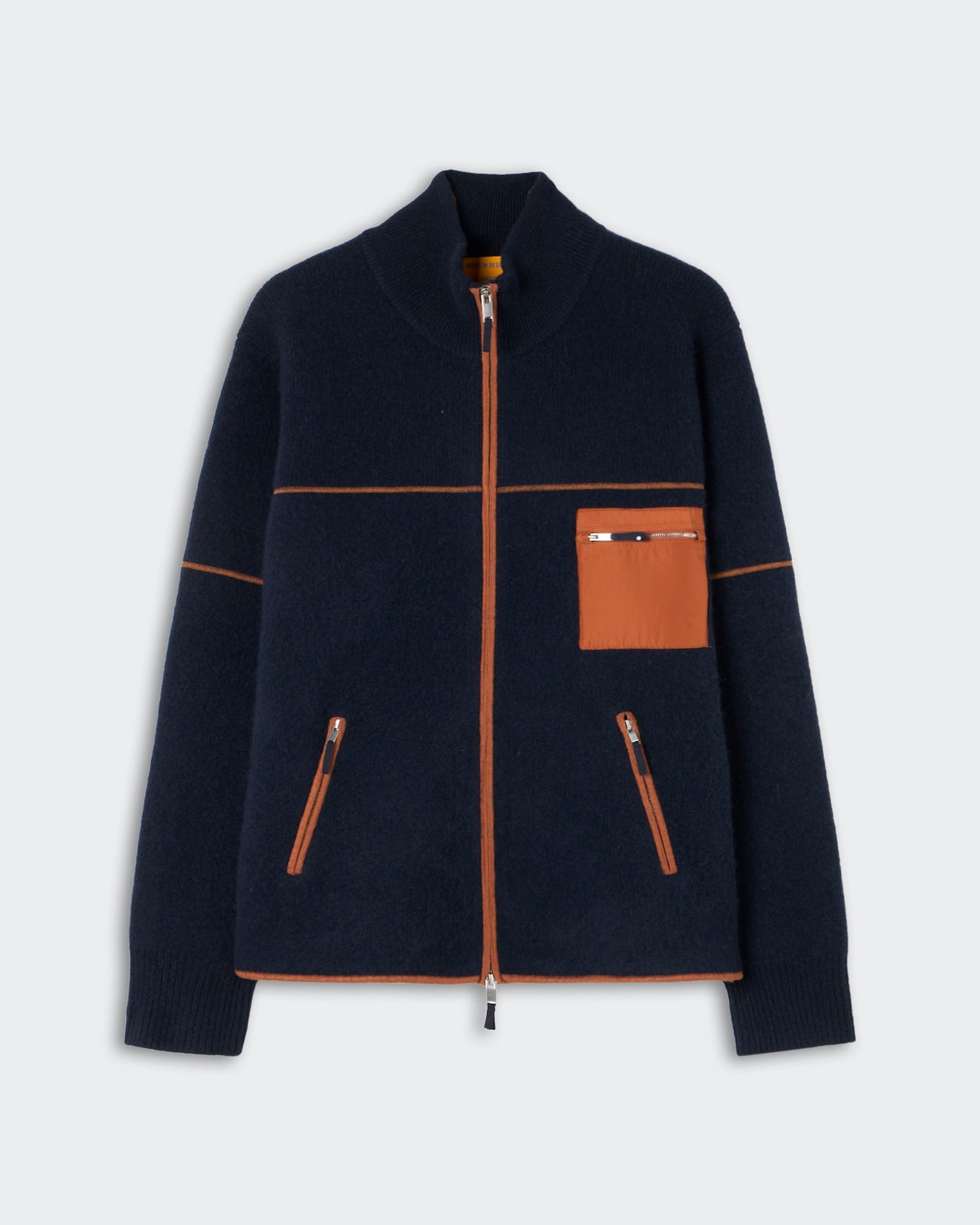 Navy blue zip-up jacket with a high collar, featuring contrasting brown trim, a brown chest pocket, and two brown zippered side pockets.