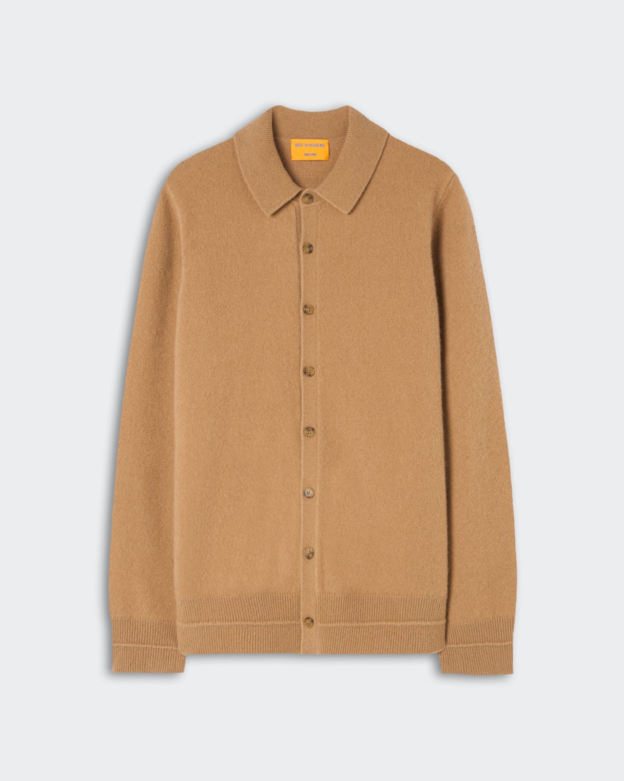 Light brown button-up cardigan with a classic collar and ribbed cuffs and hem, made of soft cashmere fabric, displayed on a plain light background.