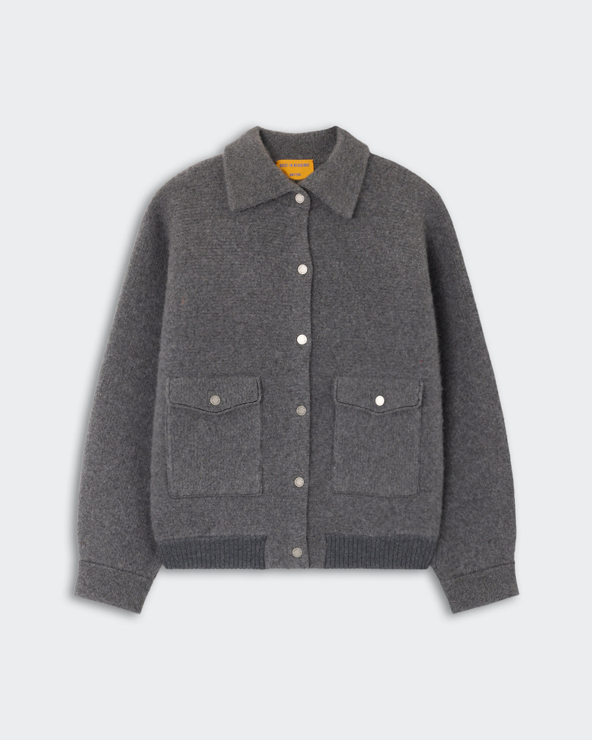Gray button-up cardigan with a collar, two front flap pockets, and ribbed cuffs and hem displayed against a light background.