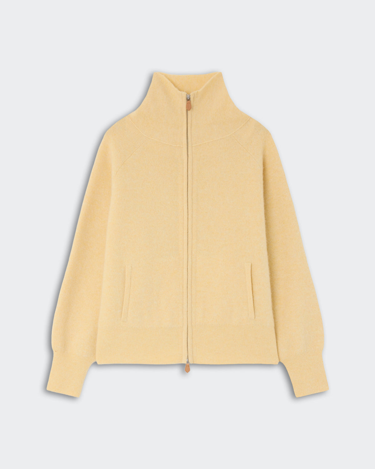 Light yellow zip-up sweater with a high collar and long sleeves, featuring front pockets and ribbed cuffs, displayed on a neutral background.