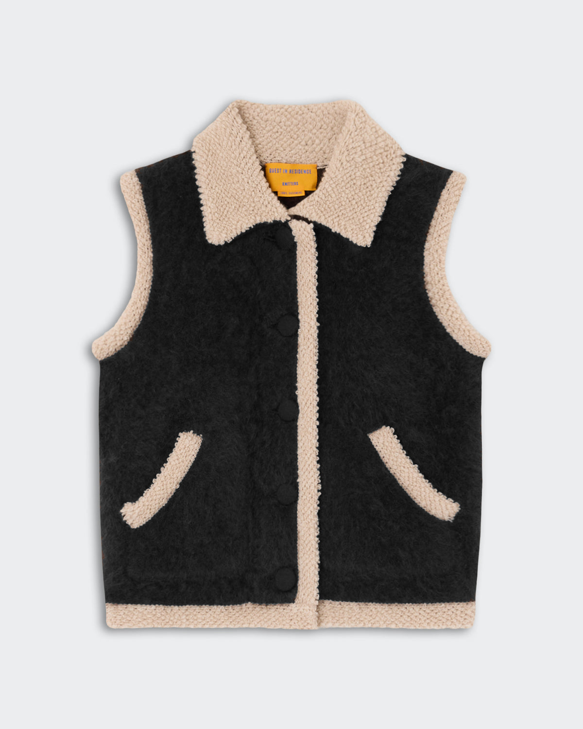 Grizzly Wrangler Vest - Black featuring a sleeveless design with contrasting cream-colored sherpa trim along the collar, front, pockets, and hem against a black textured fabric.