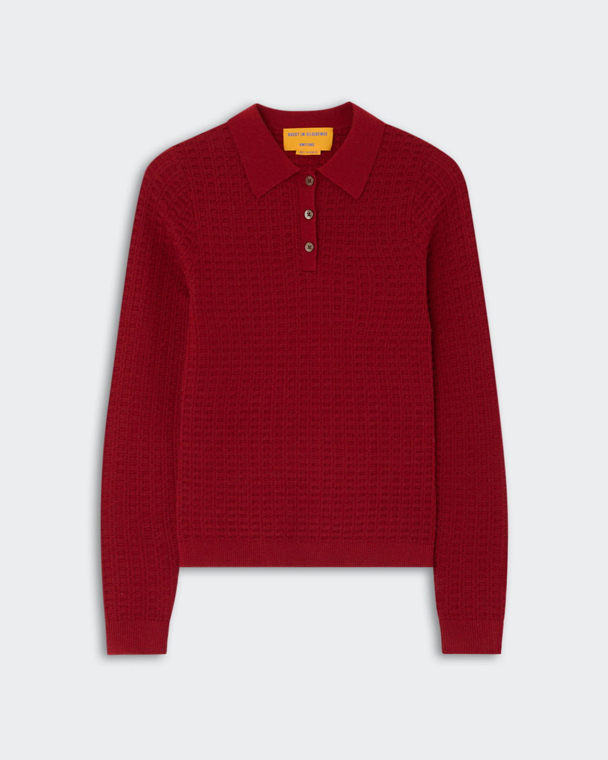 Red long-sleeve knit polo sweater with a textured pattern and three buttons on the placket, displayed on a light gray background.