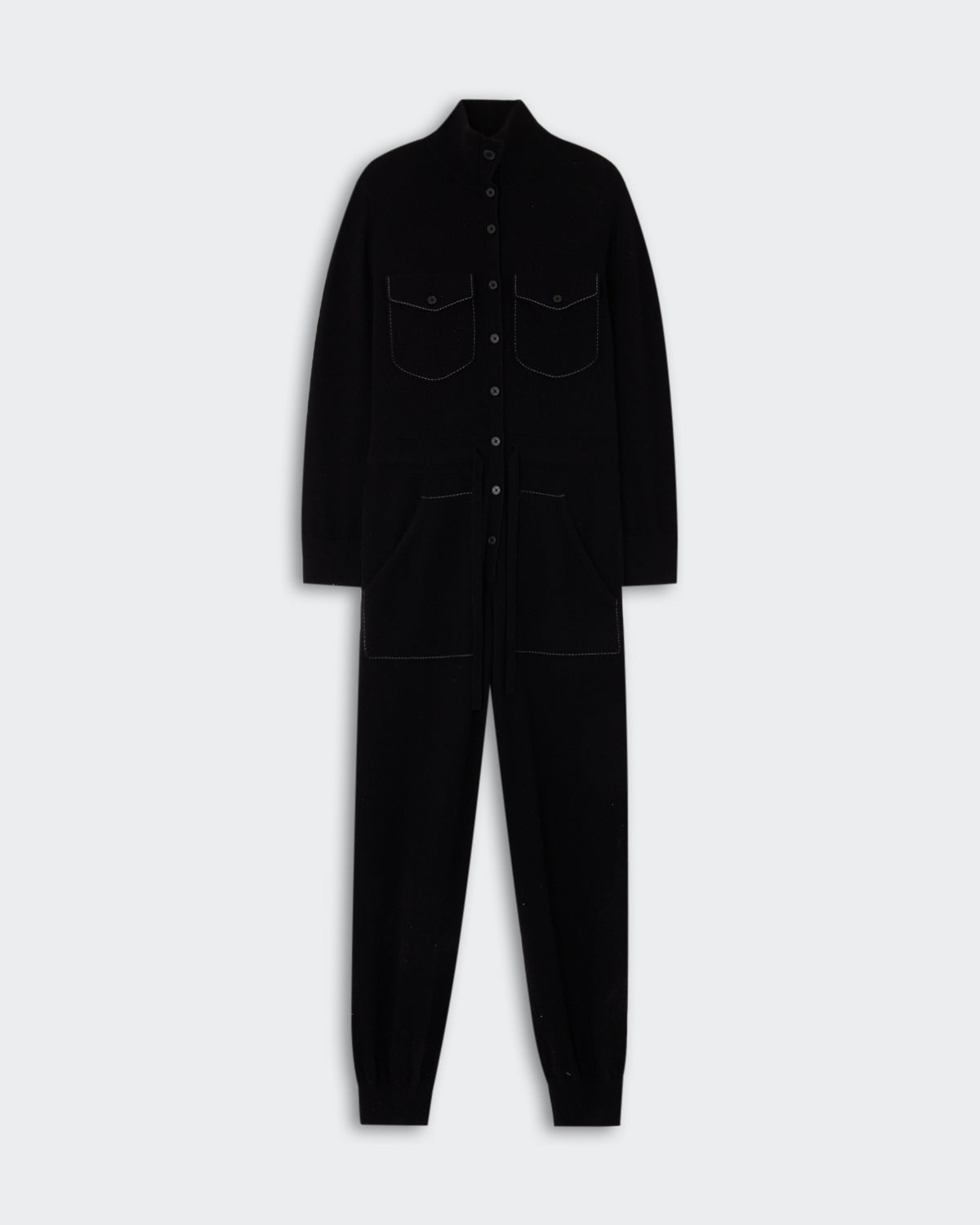 Flight Suit - Black displayed flat, featuring a button-up front, long sleeves, chest pockets, and side pockets, with a slim tapered leg design.