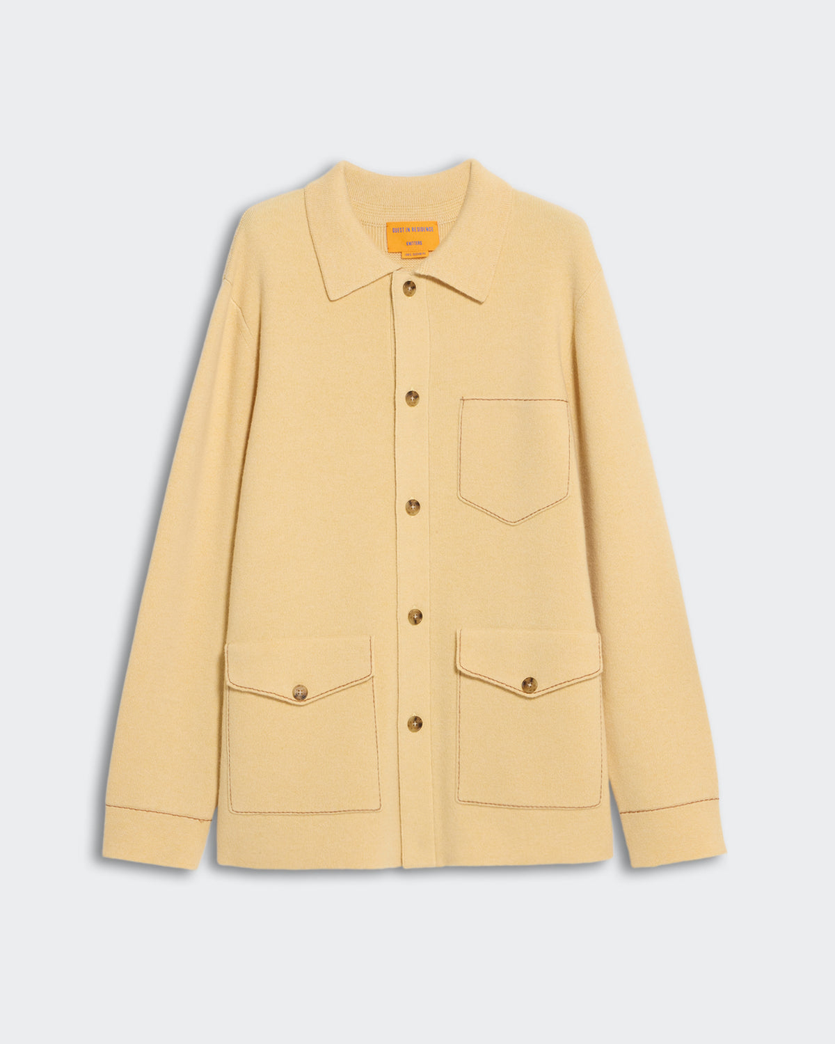 Industry Jacket Butter Almond with shirt collar, patch pockets, button closure, and contrast hand topstitching in cashmere knit.