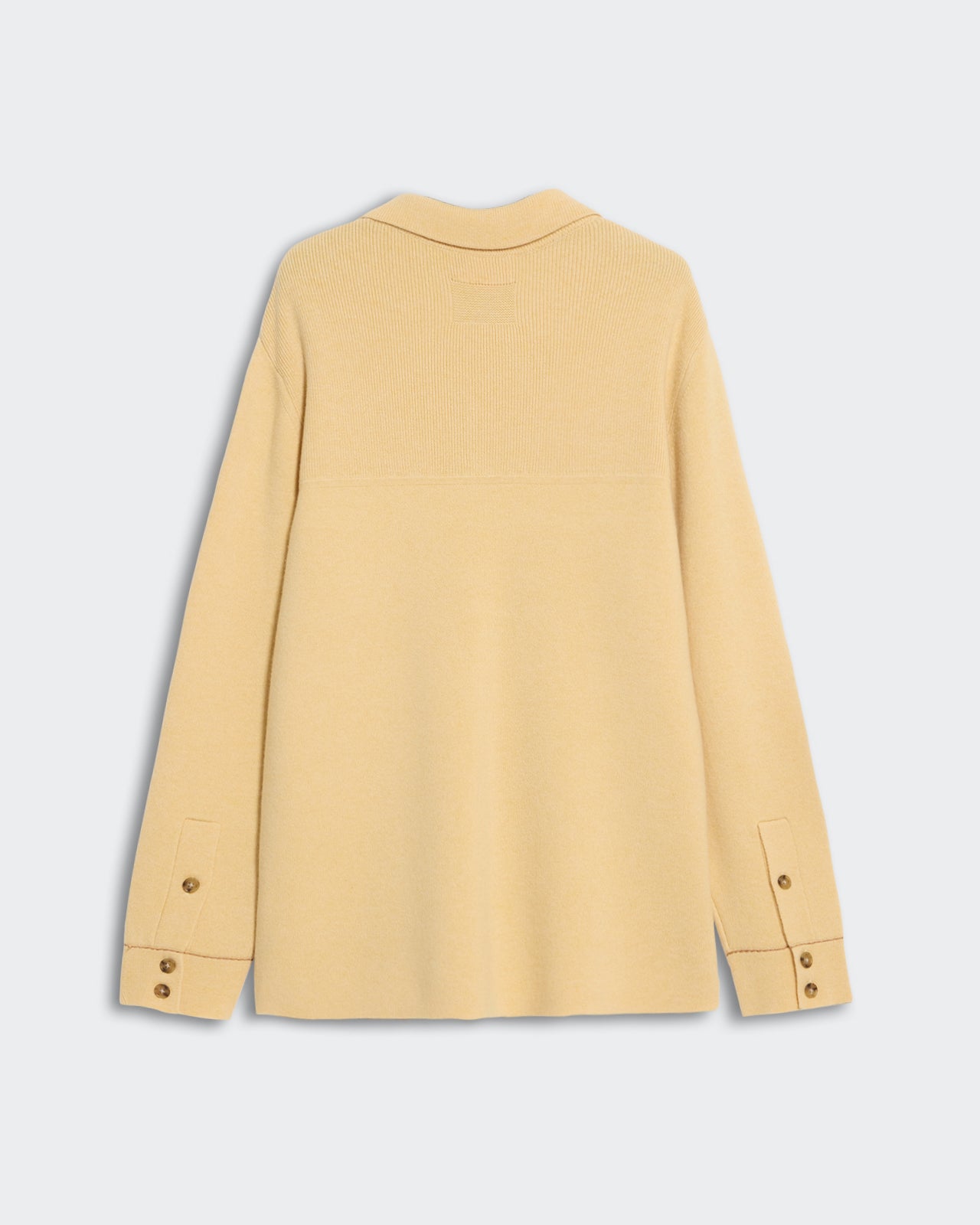 Industry Jacket Butter Almond shown from back with buttoned sleeve cuffs and shirt collar in heavy-weight cashmere knit.