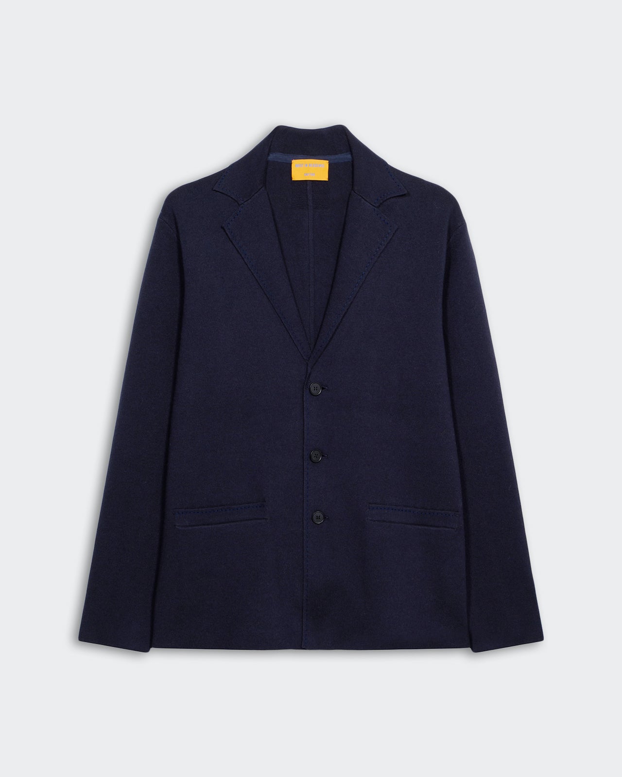 Off Duty Blazer - Midnight in dark navy with three-button front and notch lapel, laid flat on gray background.