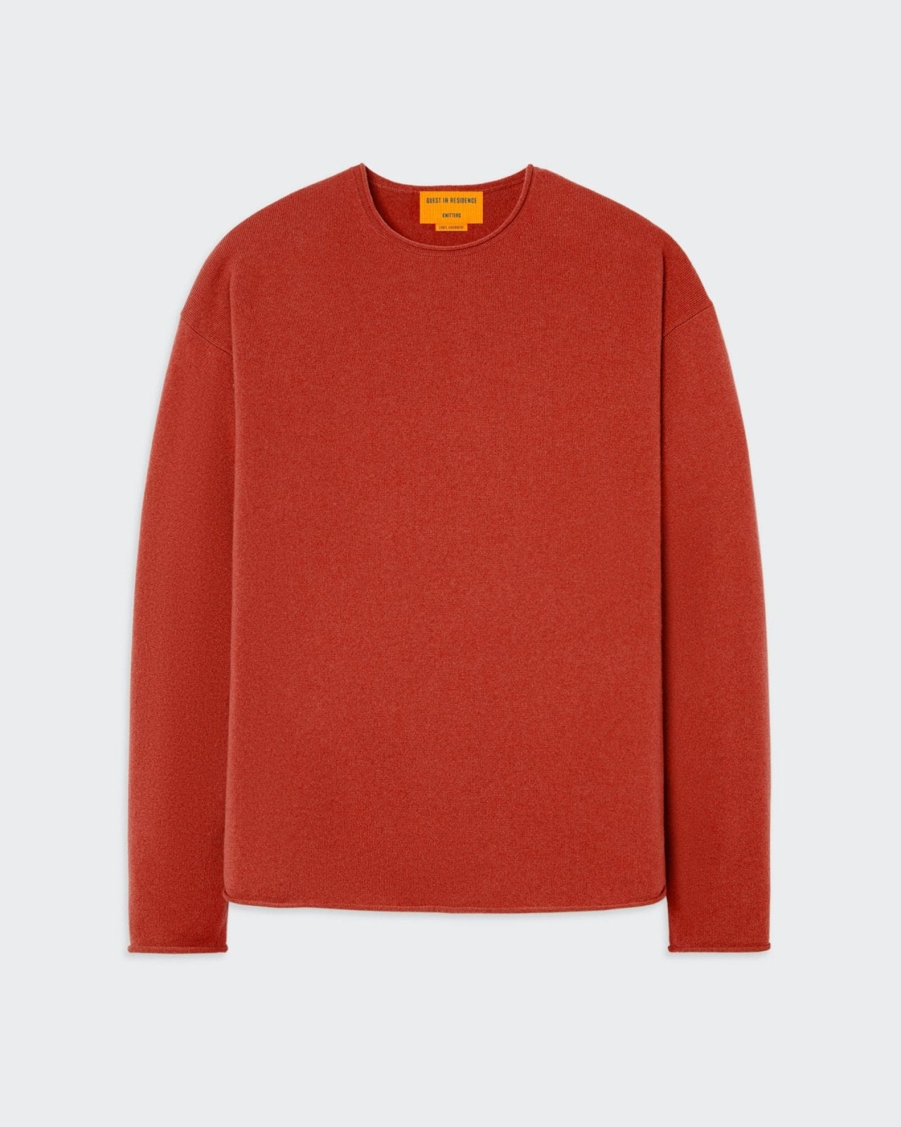 Oversized cashmere crew neck sweater in rust color.