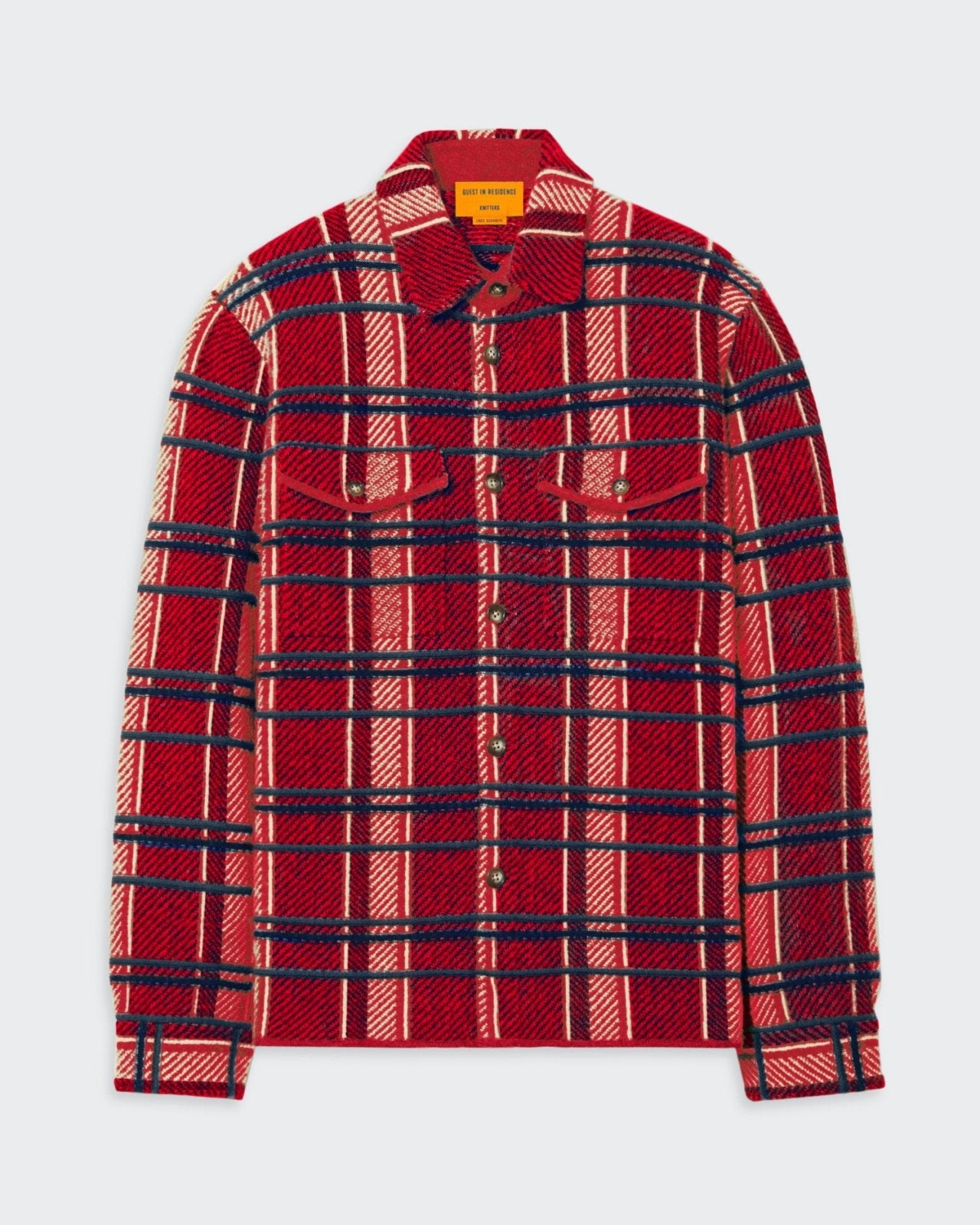 Plaid work shirt in red and blue tones, with a front button closure, shirt collar, chest patch pockets, and cuffed sleeves.