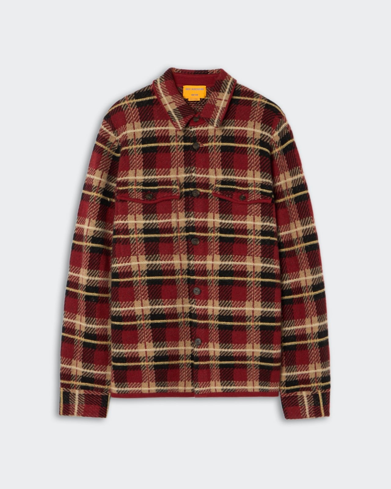 Red, black, and beige plaid button-up shirt jacket with long sleeves, a collar, and a front chest pocket laid flat on a gray background.