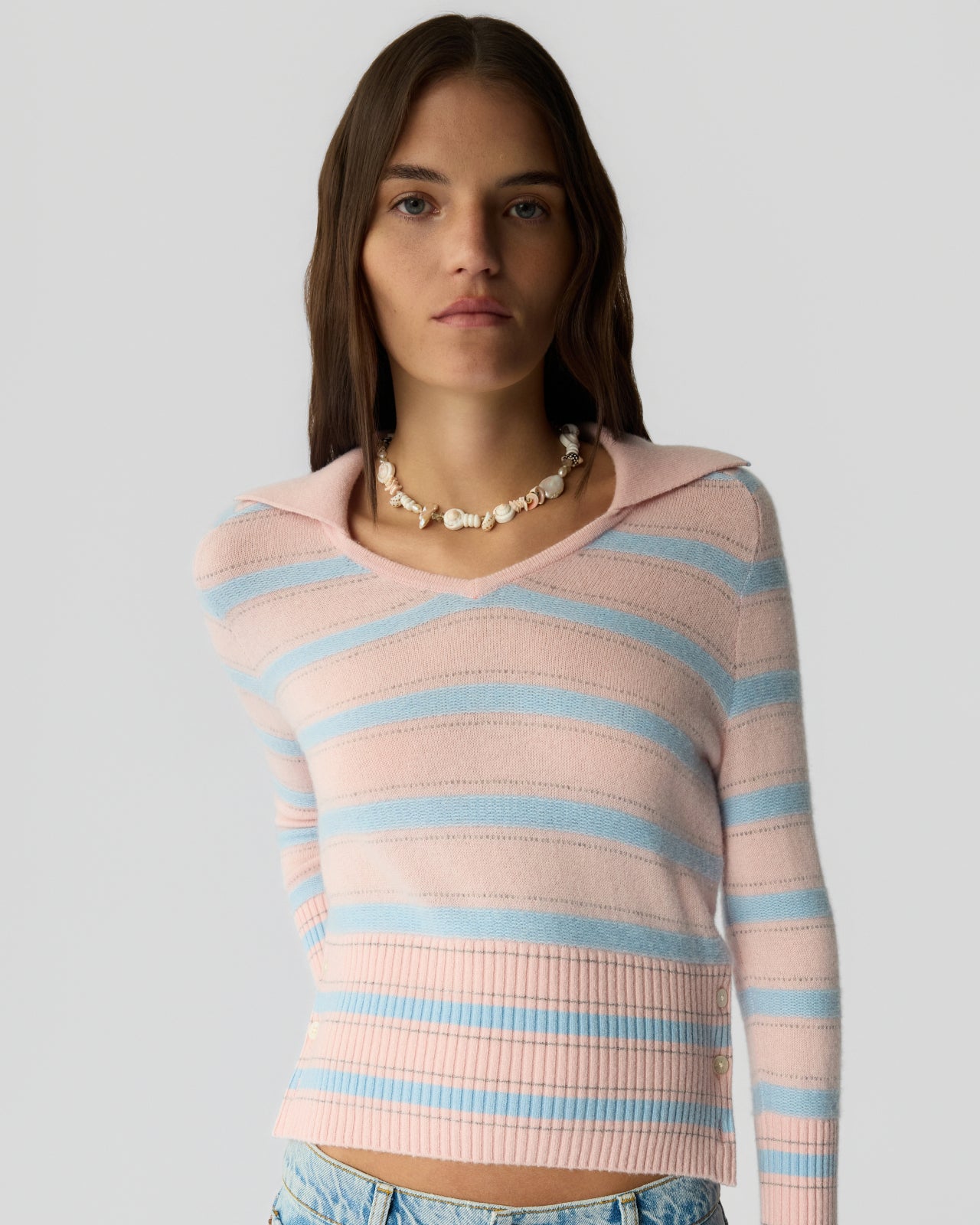 A close-up of the Port Polo in Powder Pink Combo, showcasing the texture of 100% cashmere.