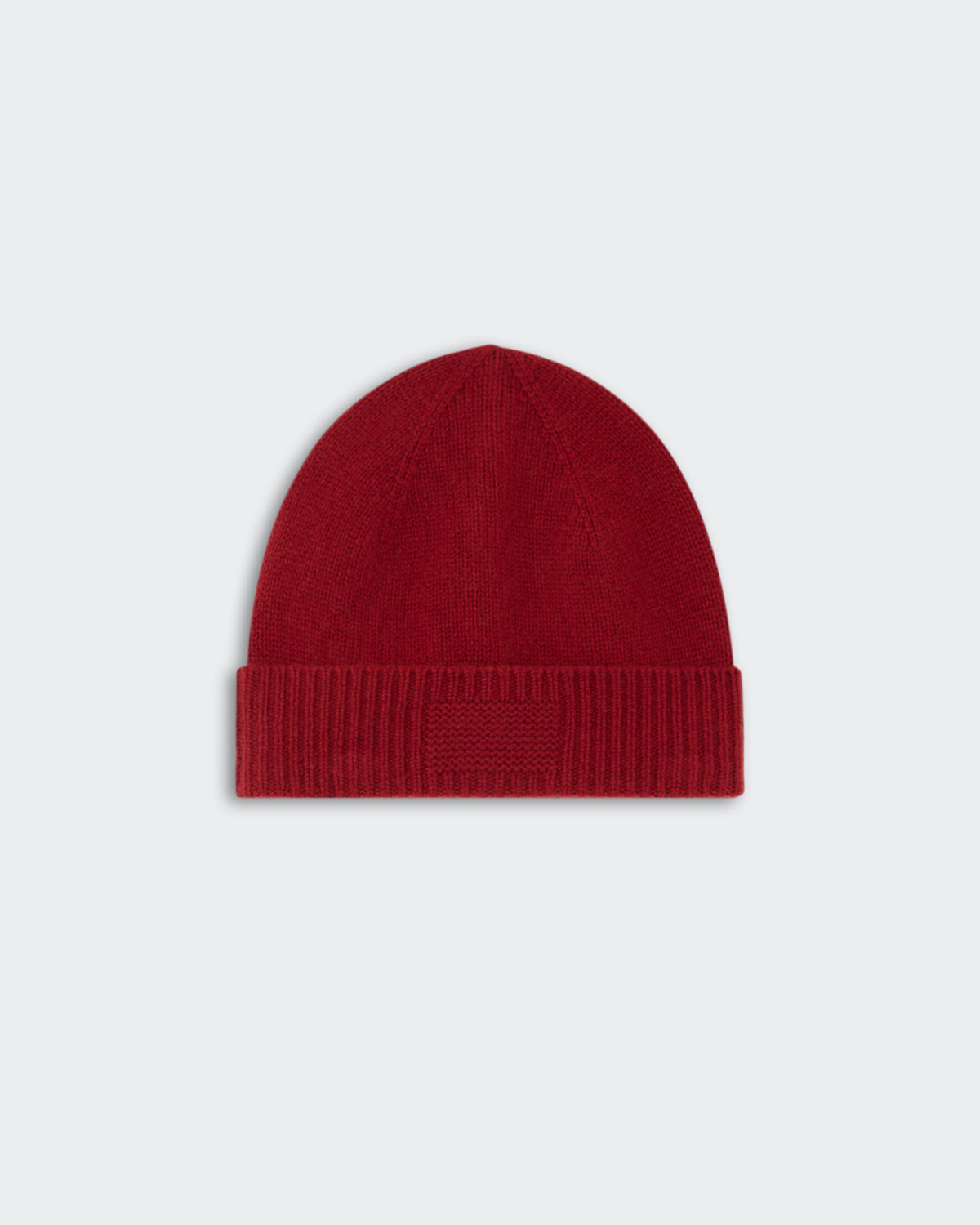 Rib Cuff Beanie - Carmine in a rich red color, featuring a ribbed cuff design for a snug and stylish fit.