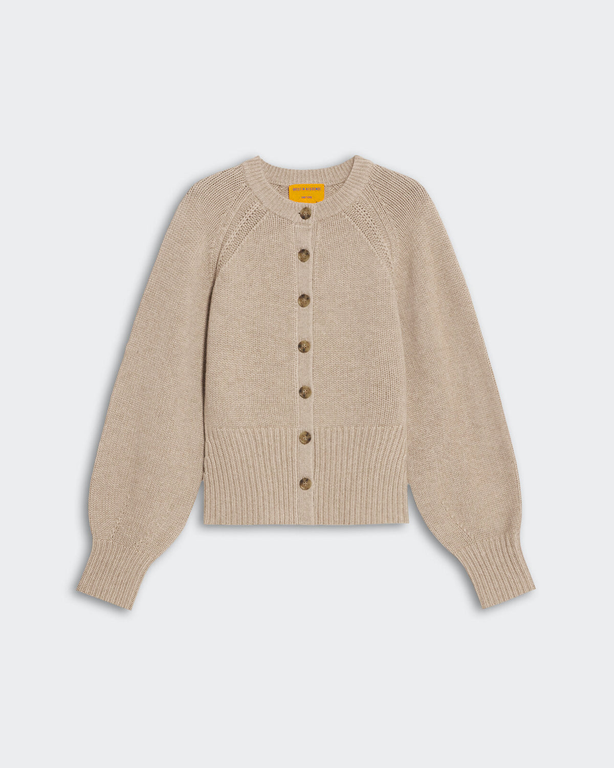 Taupe women’s cashmere sculpted cardigan with puffed raglan sleeves, front buttons, and ribbed hem and cuffs.