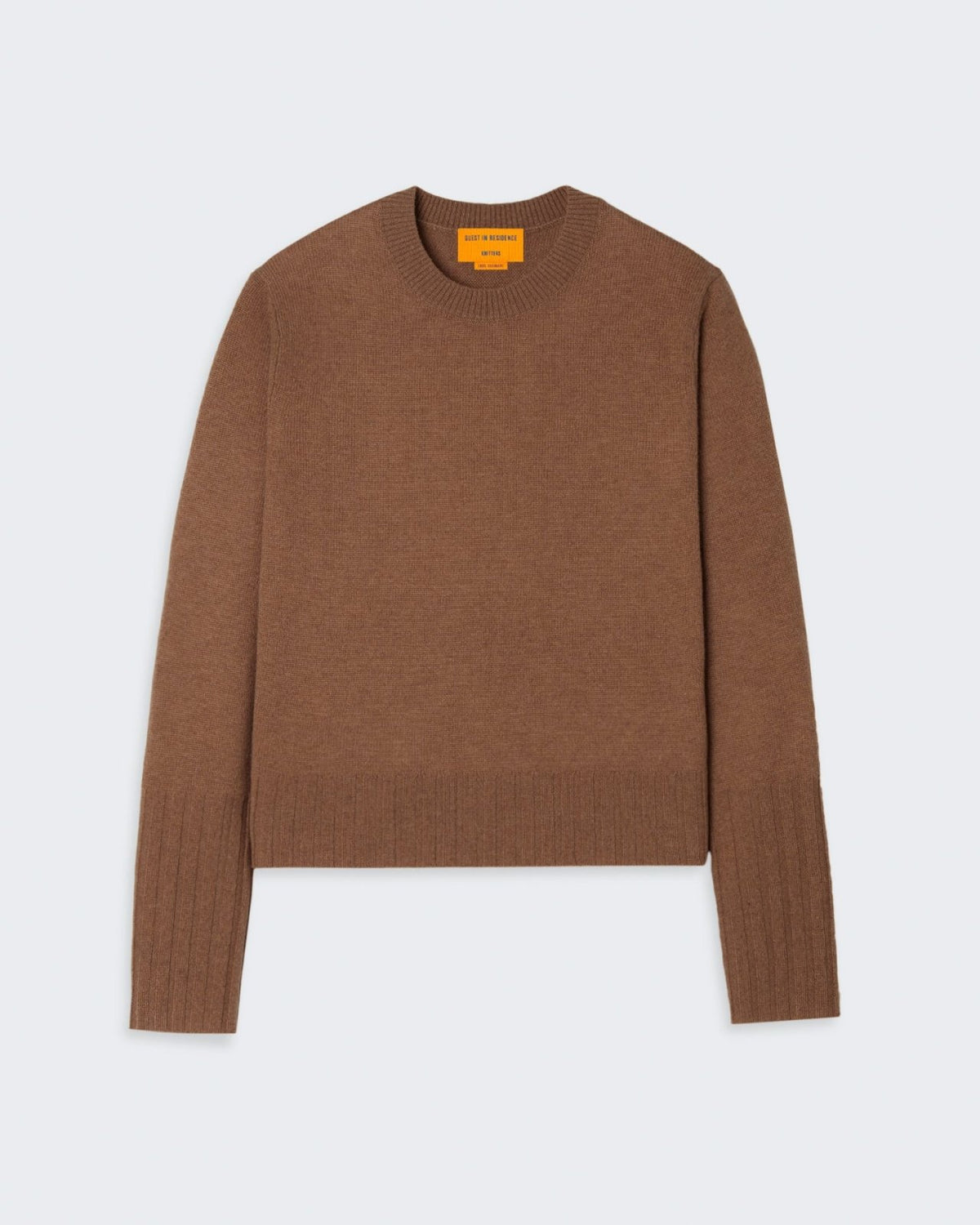 A brown cashmere sweater with a high ribbed sleeve cuff and hem.