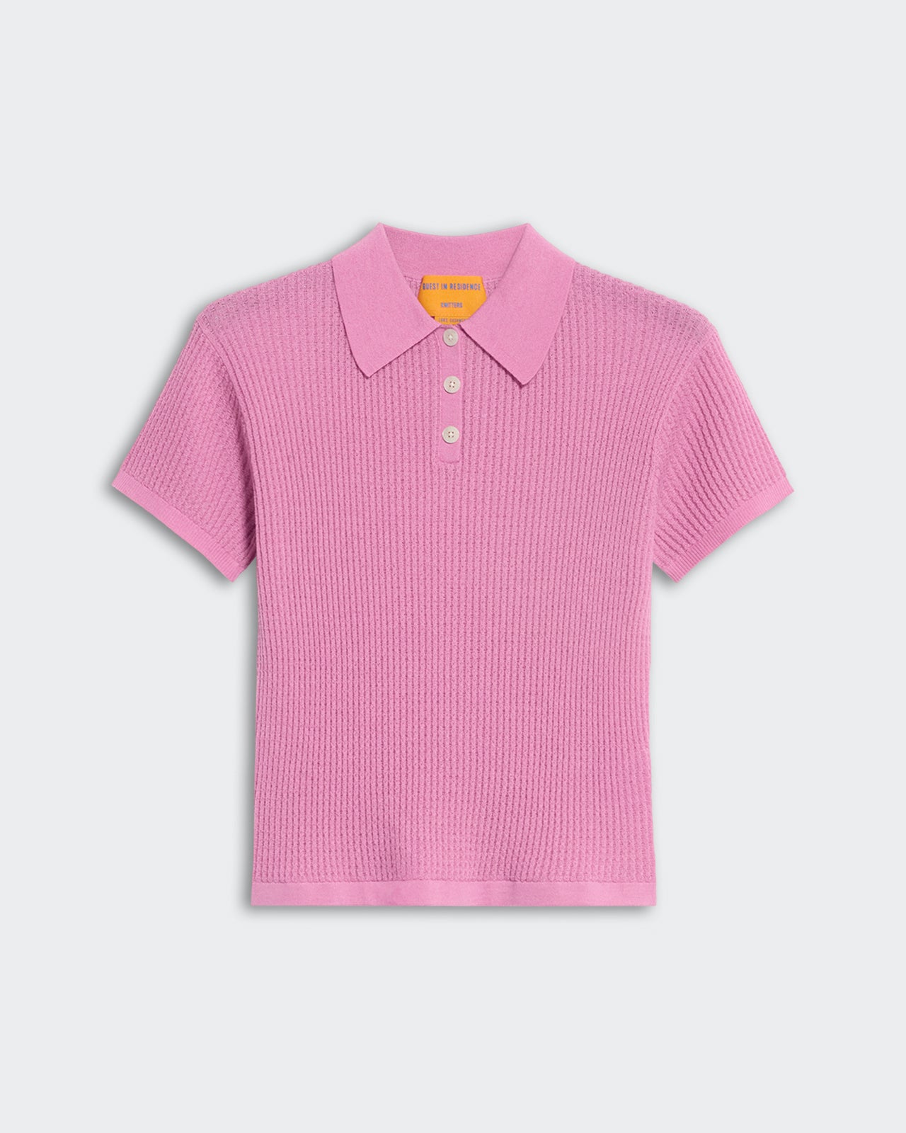 Lightweight rose pink women's polo shirt with textured waffle knit and three-button placket in cashmere