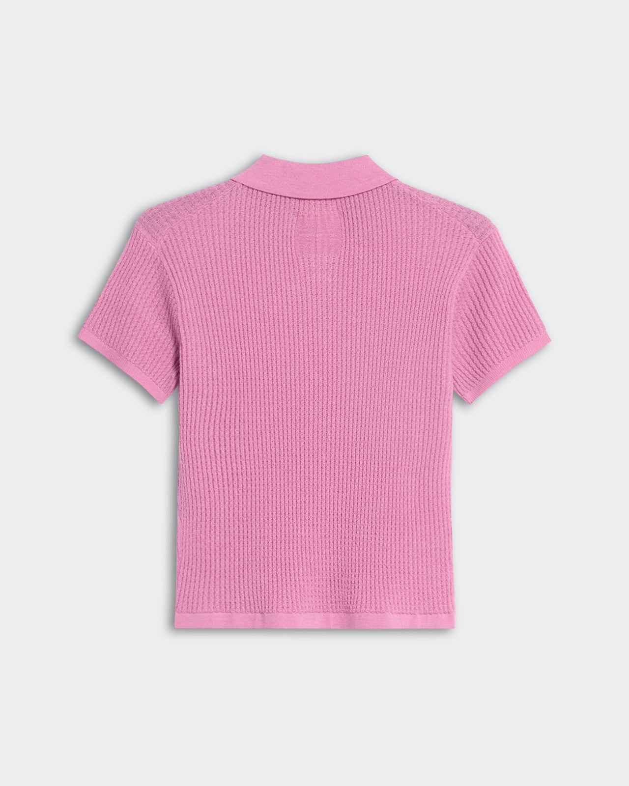 Back view of a women's shrunken polo shirt in rose color with waffle knit texture and short sleeves