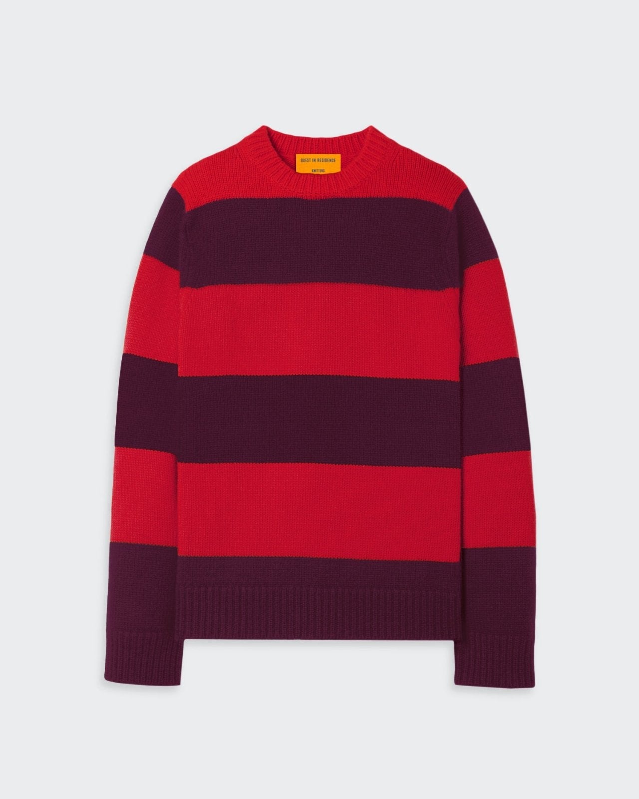 Red and purple striped knitted sweater.