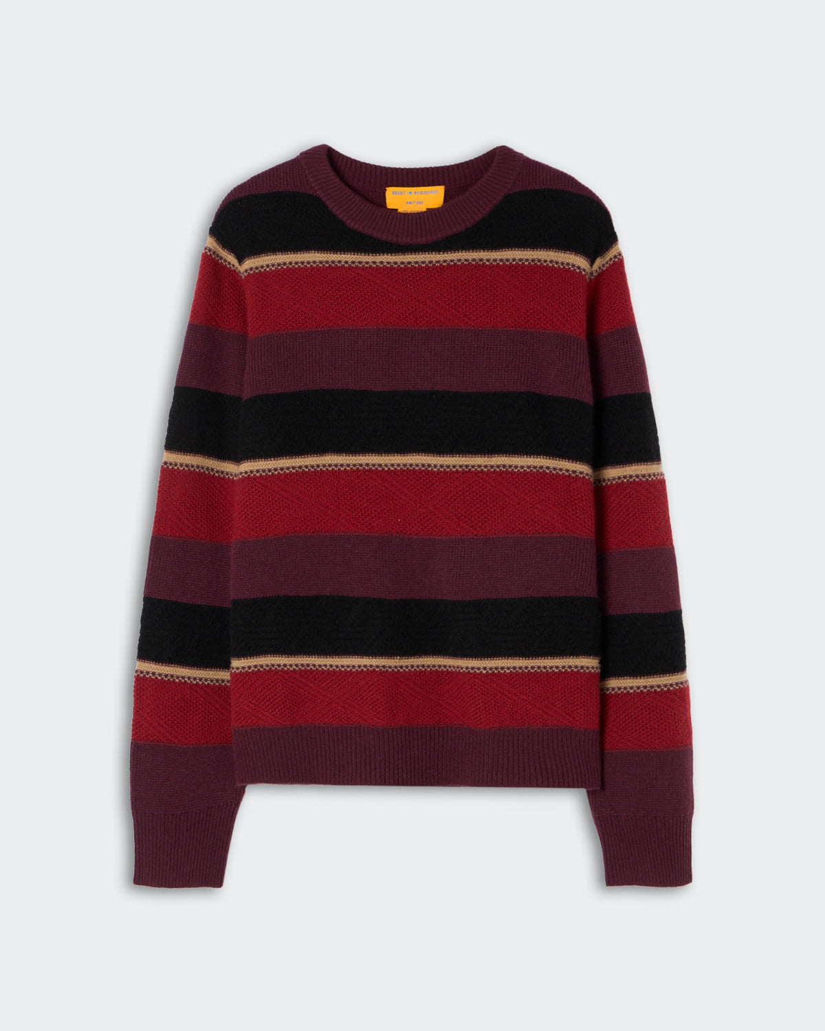 Knit sweater with horizontal stripes in shades of burgundy, red, black, and beige, featuring a crew neck and long sleeves against a plain background.