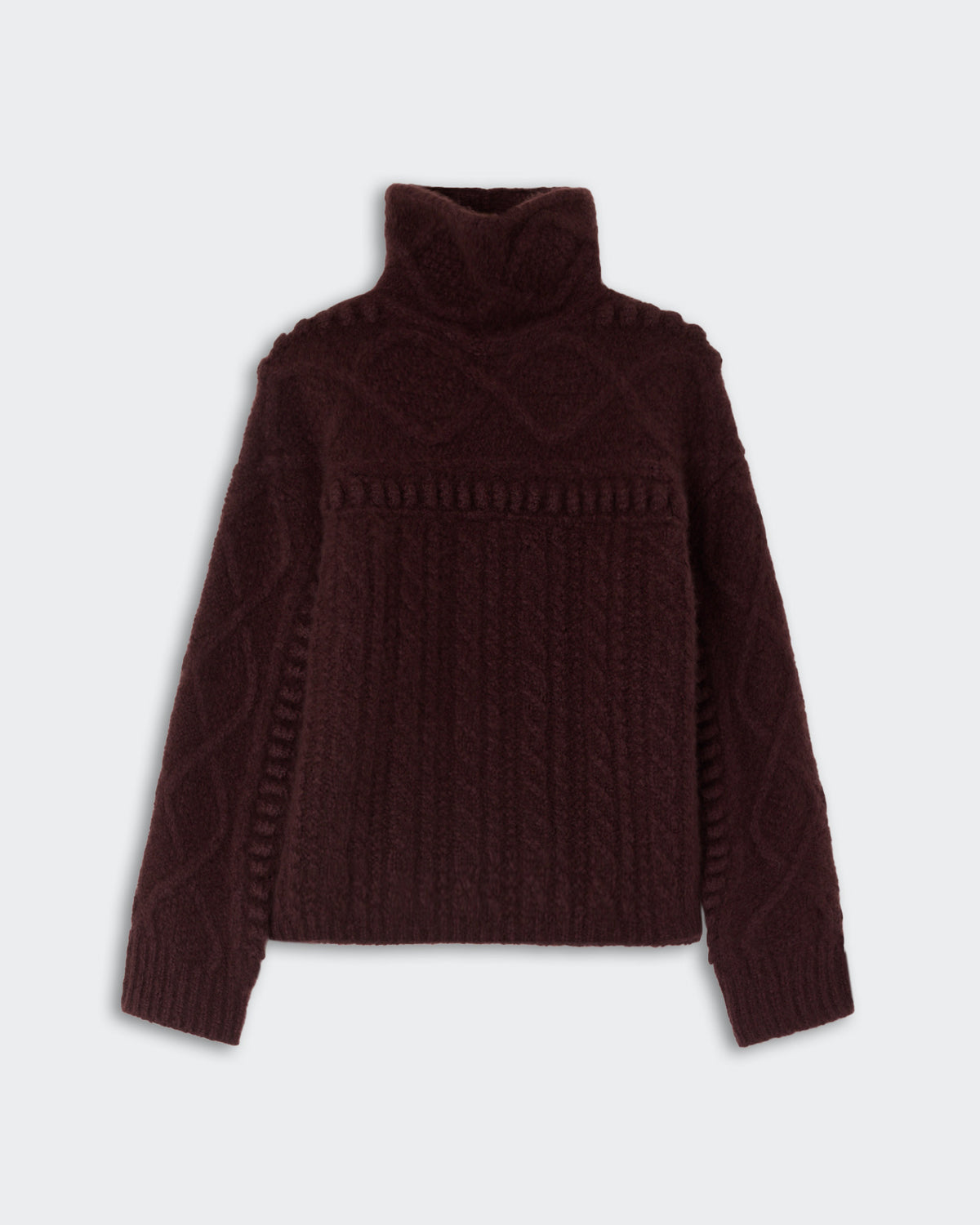 Dark brown cable knit turtleneck sweater with long sleeves and textured patterns on the front and arms, displayed against a plain light background.