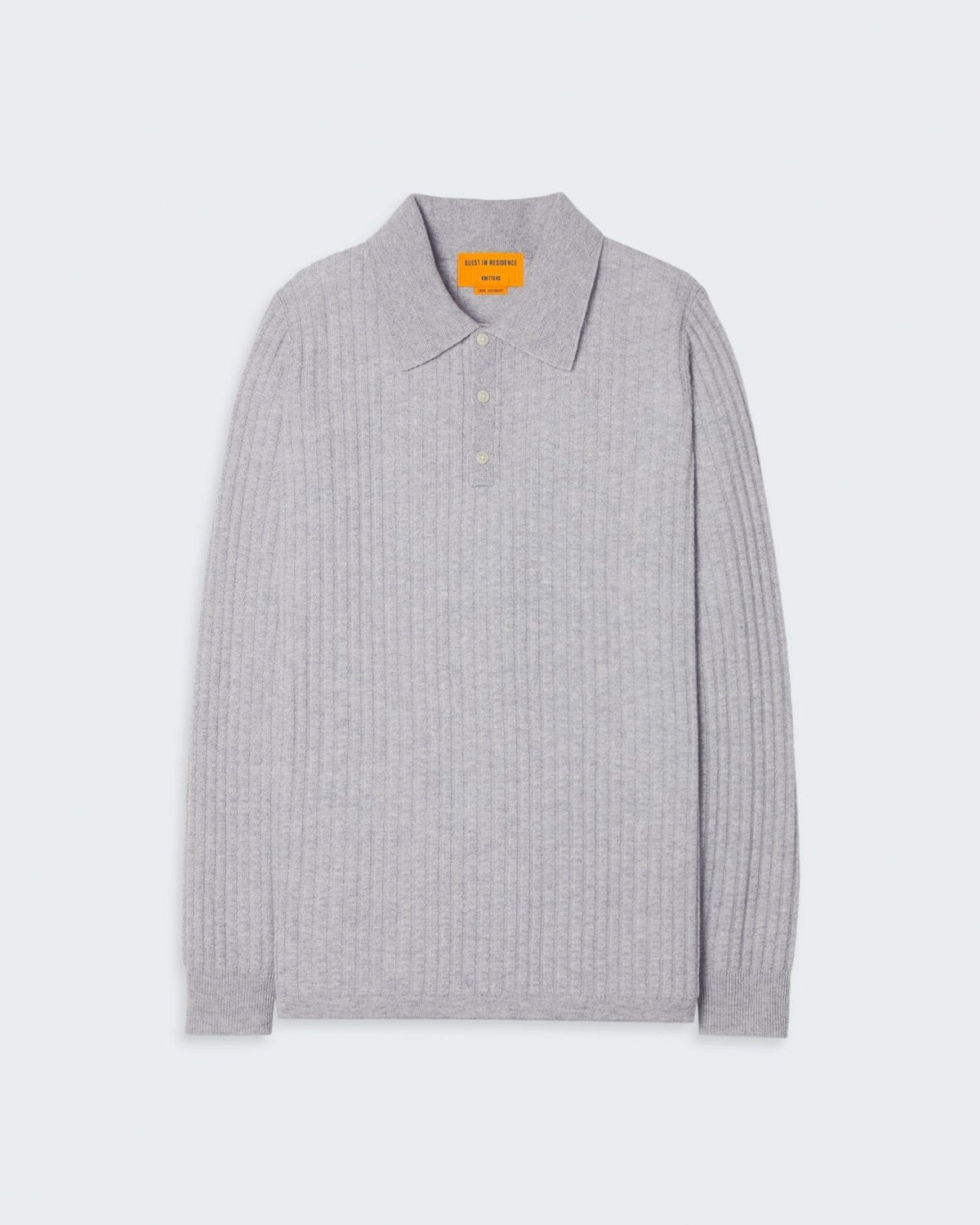 A gray cashmere polo shirt with a ribbed texture and a three-button placket on the collar.