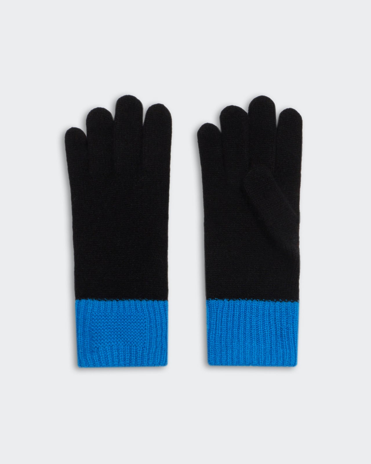 Black gloves with bright blue cuffs laid flat on a light gray background, showing both palm and back sides.