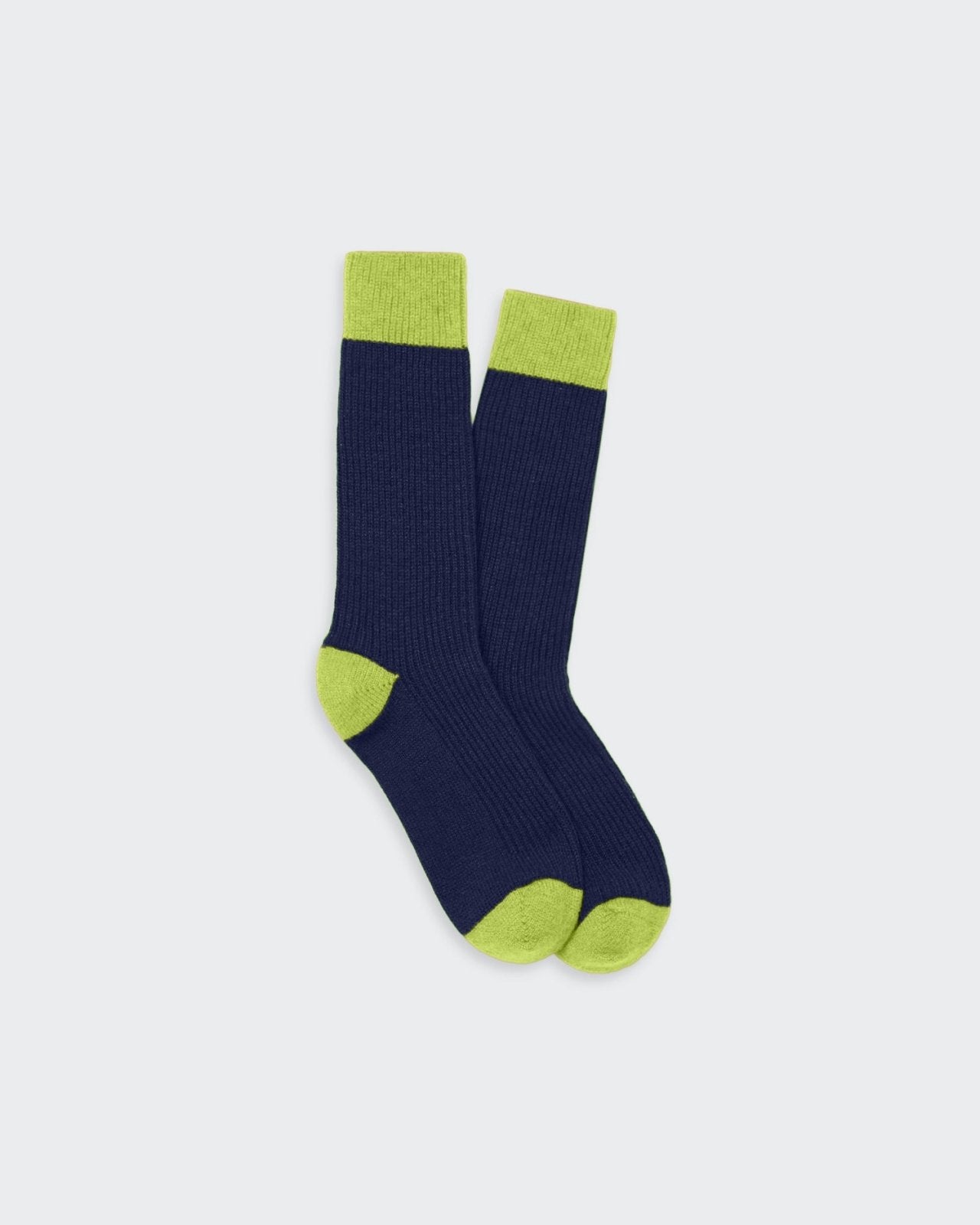 Soft cashmere socks in navy and light green hues, featuring a cozy contrast color-blocking design.