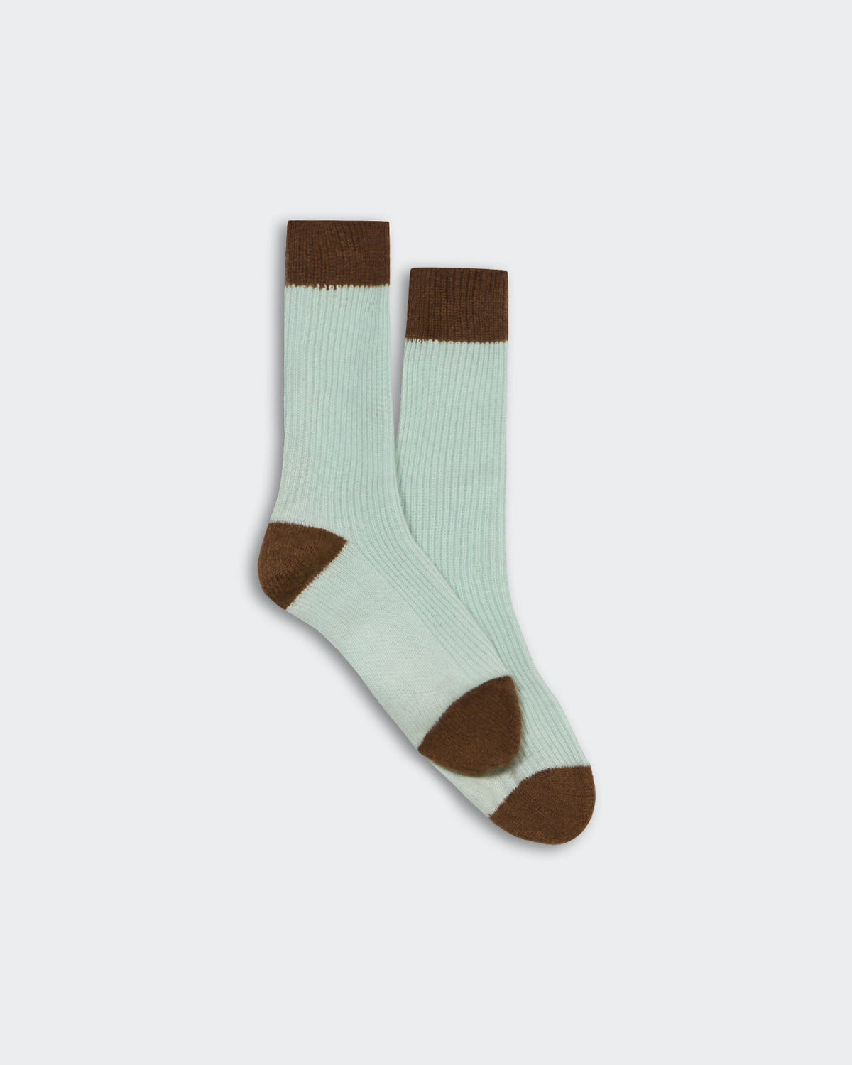 Unisex cashmere socks in seaglass and chestnut color-block design, soft ribbed texture, one size fits all.