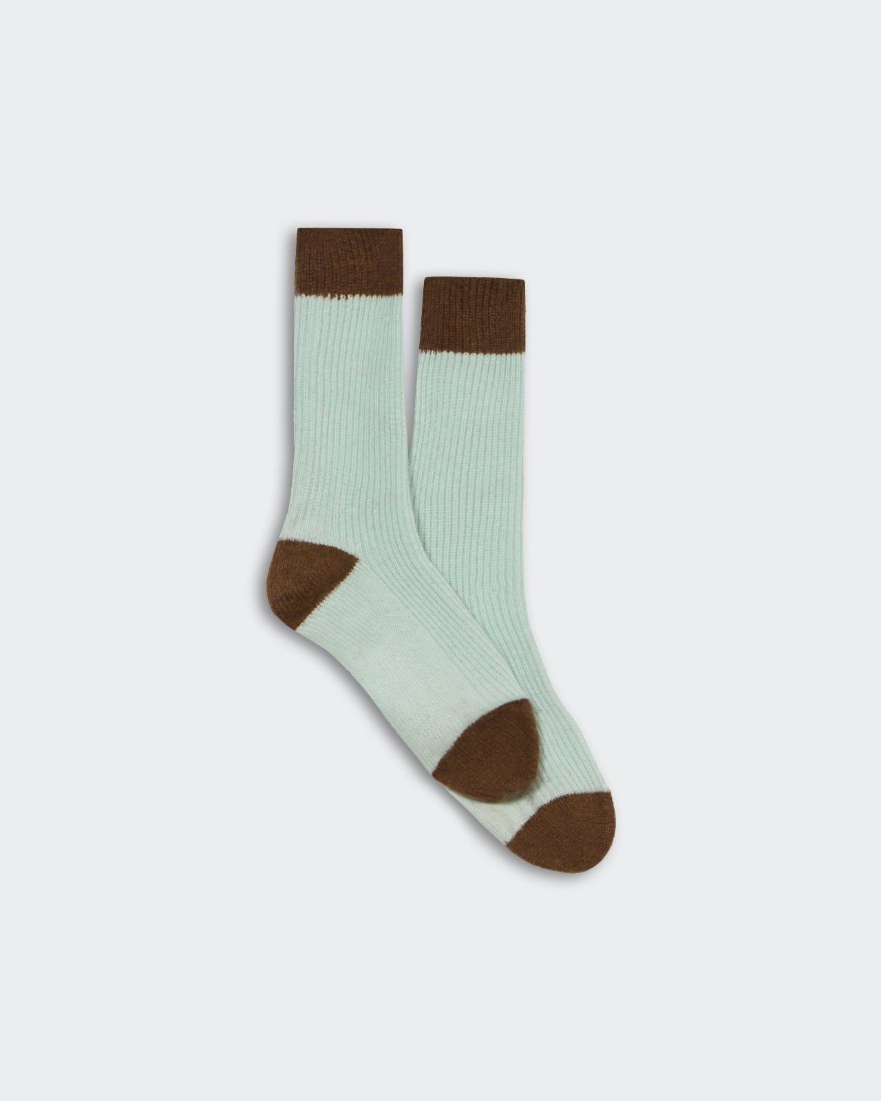 Unisex cashmere socks in seaglass and chestnut color-block design, soft ribbed texture, one size fits all.