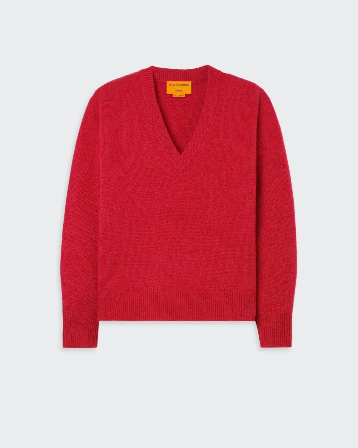 Red V-neck sweater with ribbed neck, cuff, and hem and GIR branding at center back.