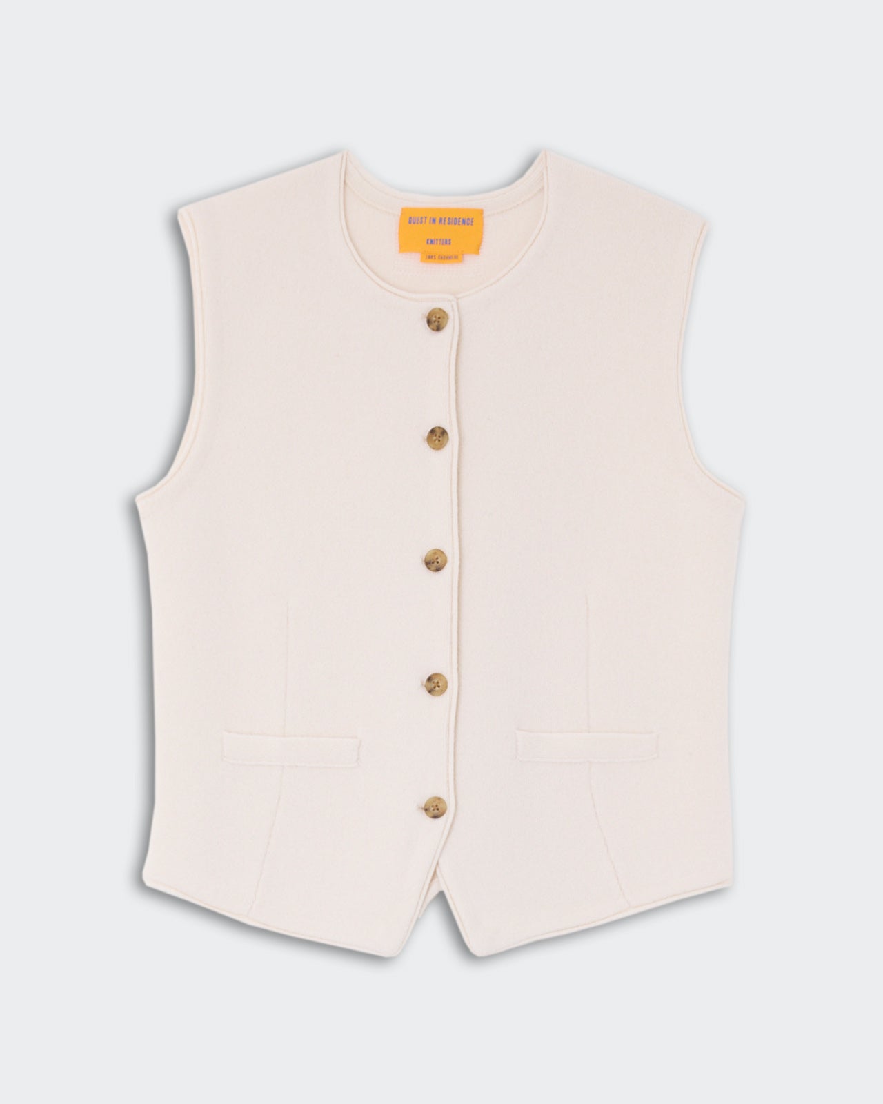 Tailored Crew Vest - Cream with a sleeveless design, front button closure, and two front pockets, made from soft cashmere fabric.