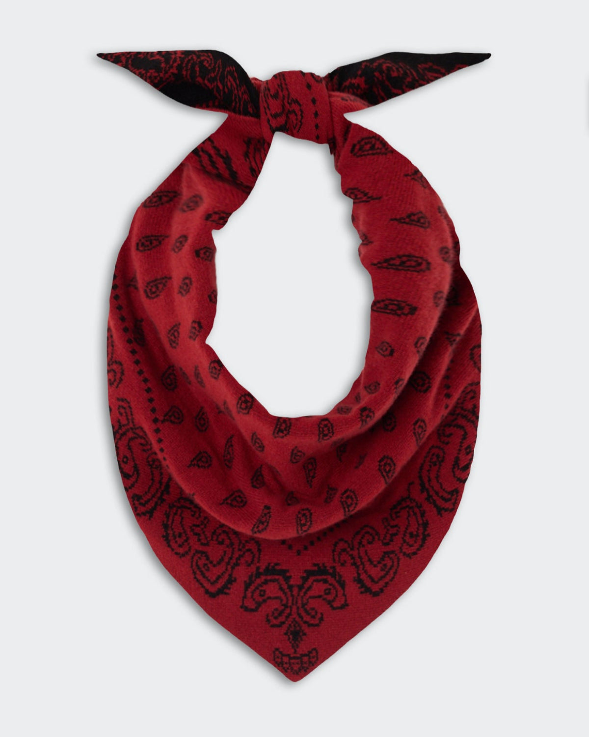 The Wild Rag - Carmine/Black featuring a rich carmine red fabric with intricate black paisley patterns, tied in a knot showcasing its soft texture and elegant design.