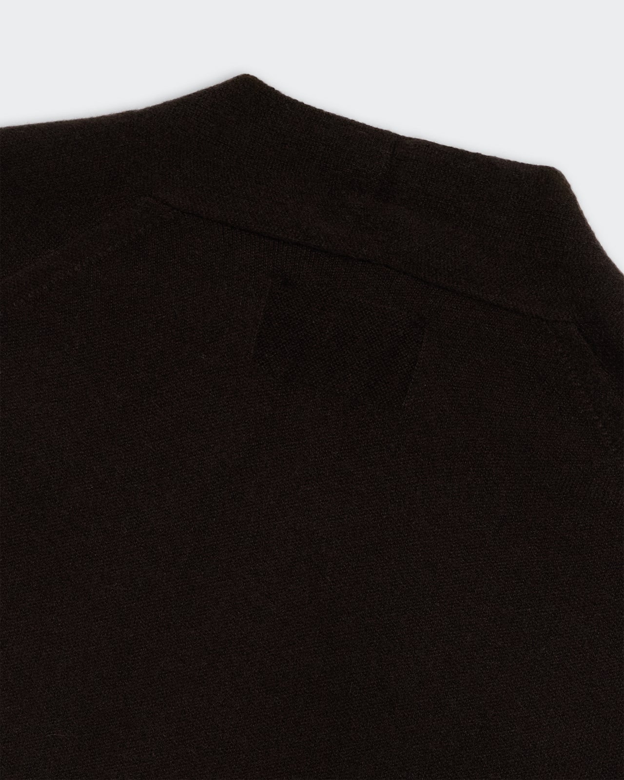 Everywear Cardigan - Burnt Cocoa close-up of premium cashmere fabric and signature GIR branding at center back neck.